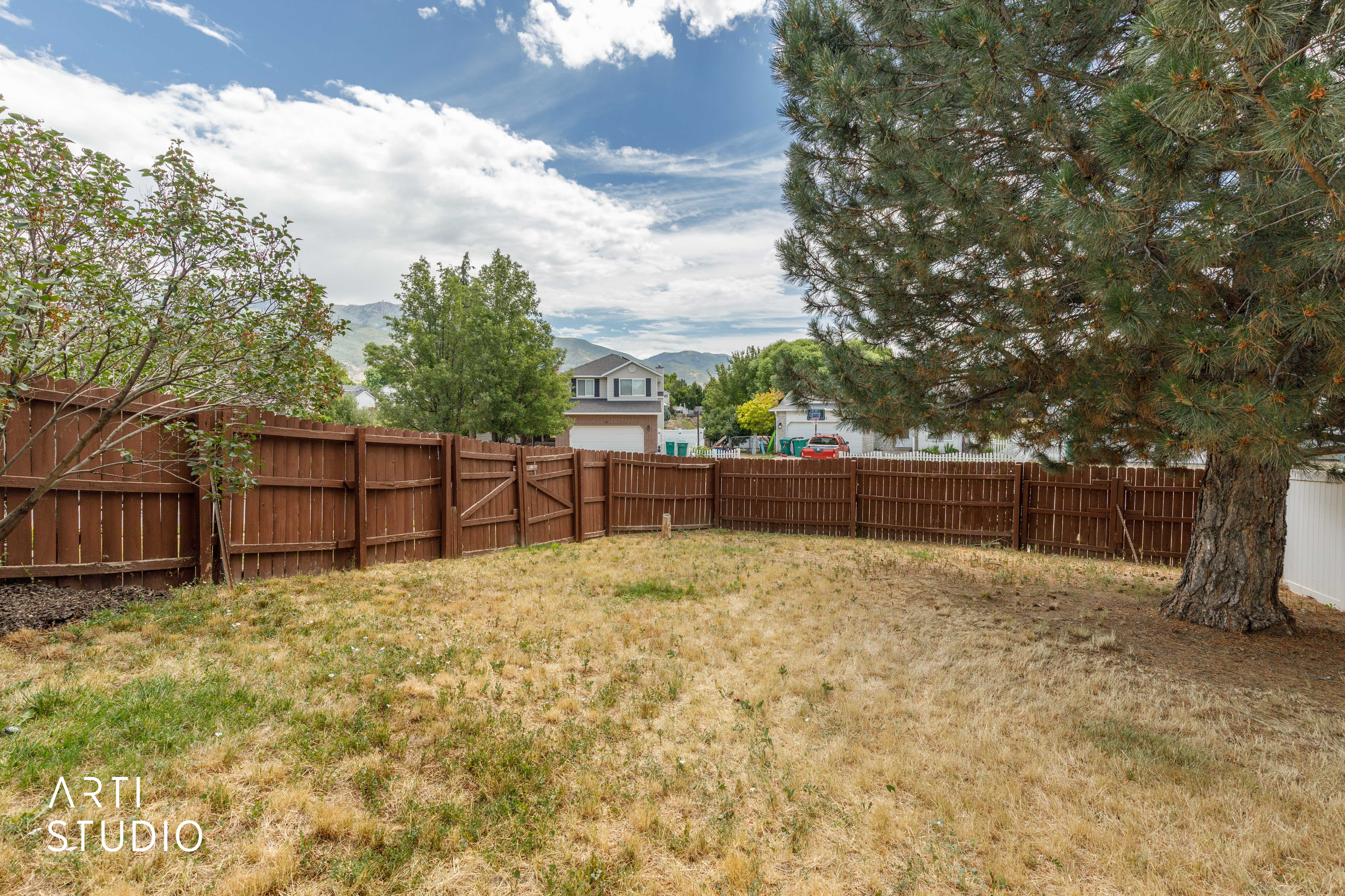 Expansive backyard space with a full privacy fence