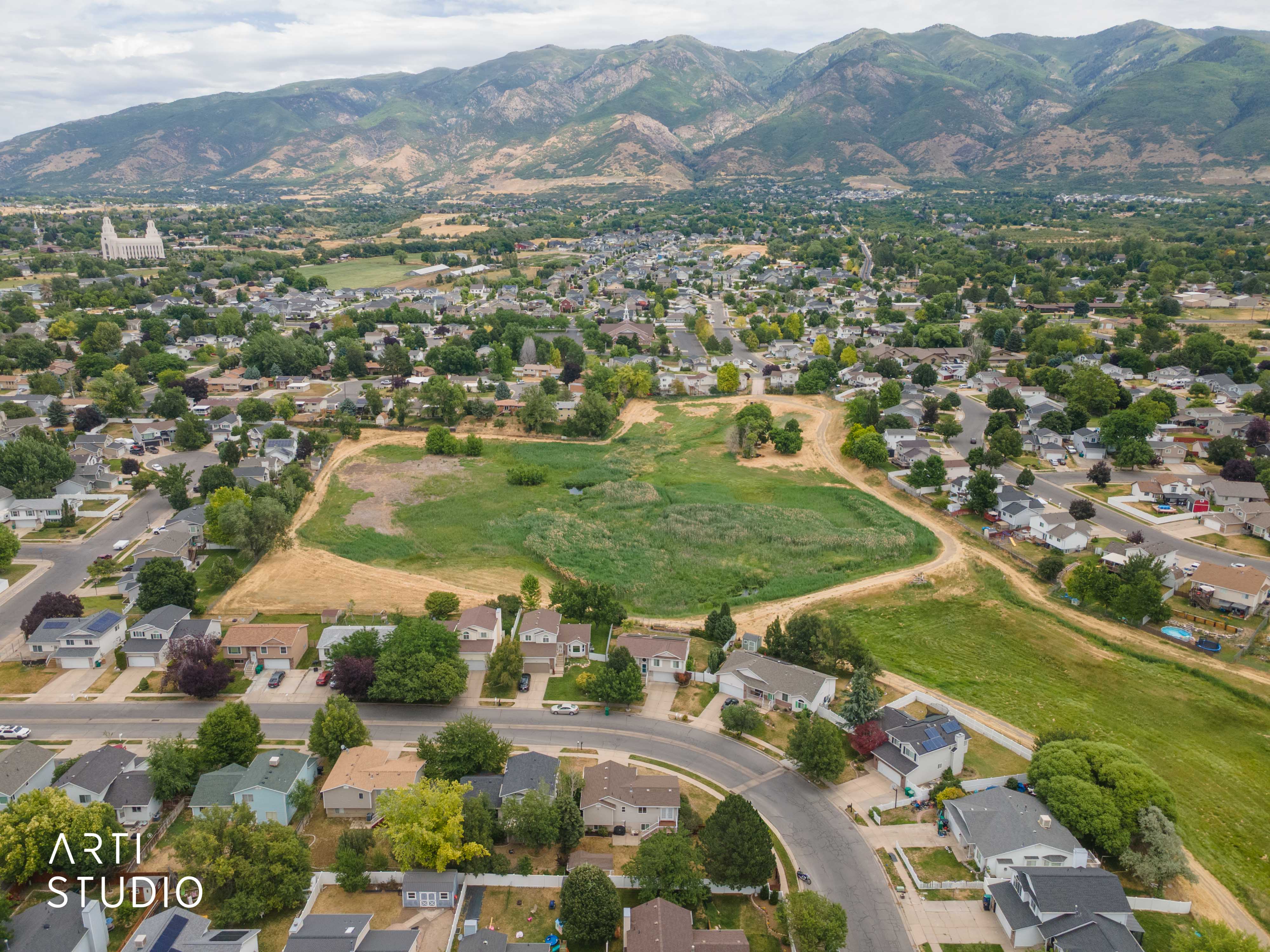 Aerial perspective showcasing residential areas with mountain backdrop