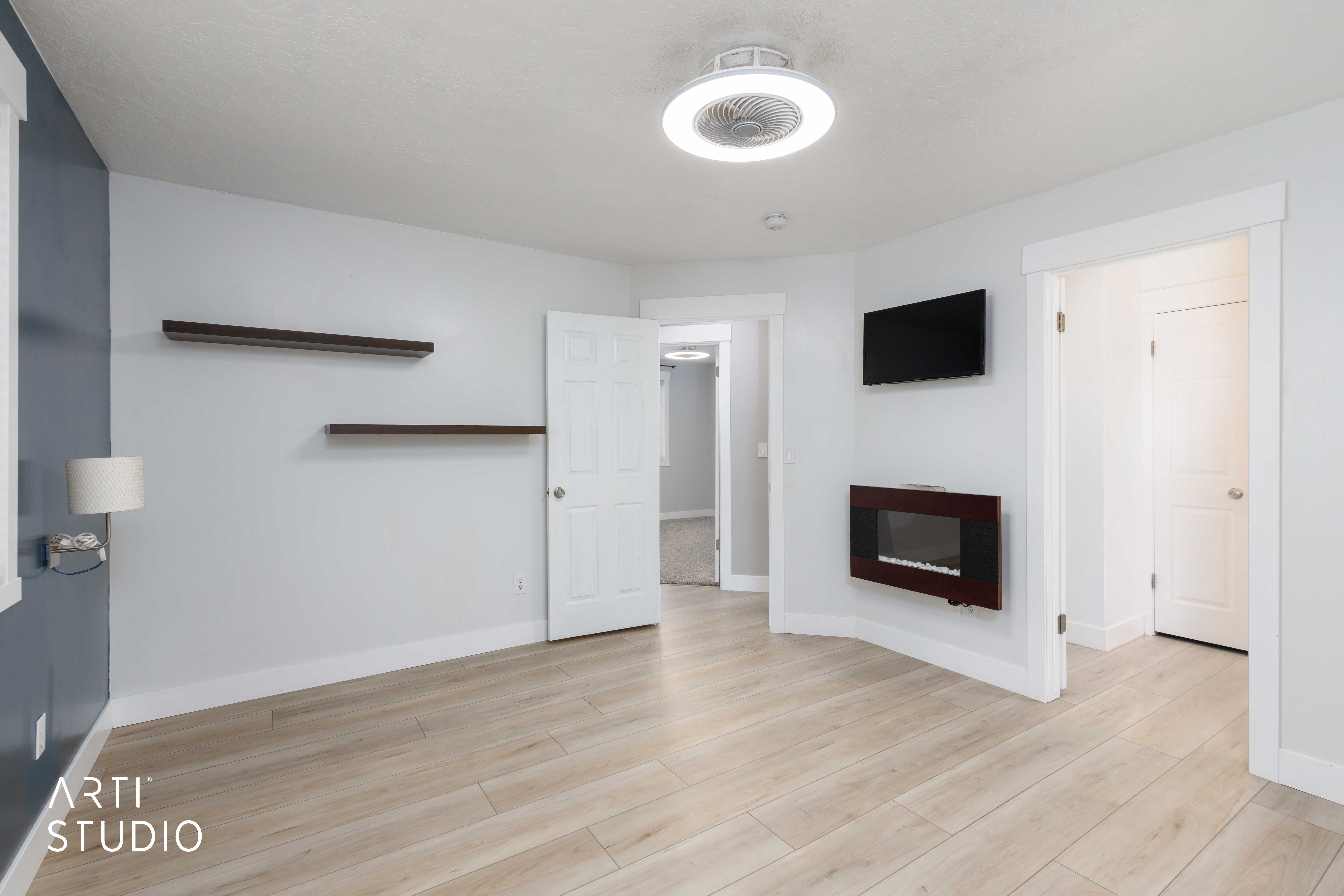 Light wood-finish flooring complements the neutral wall tones