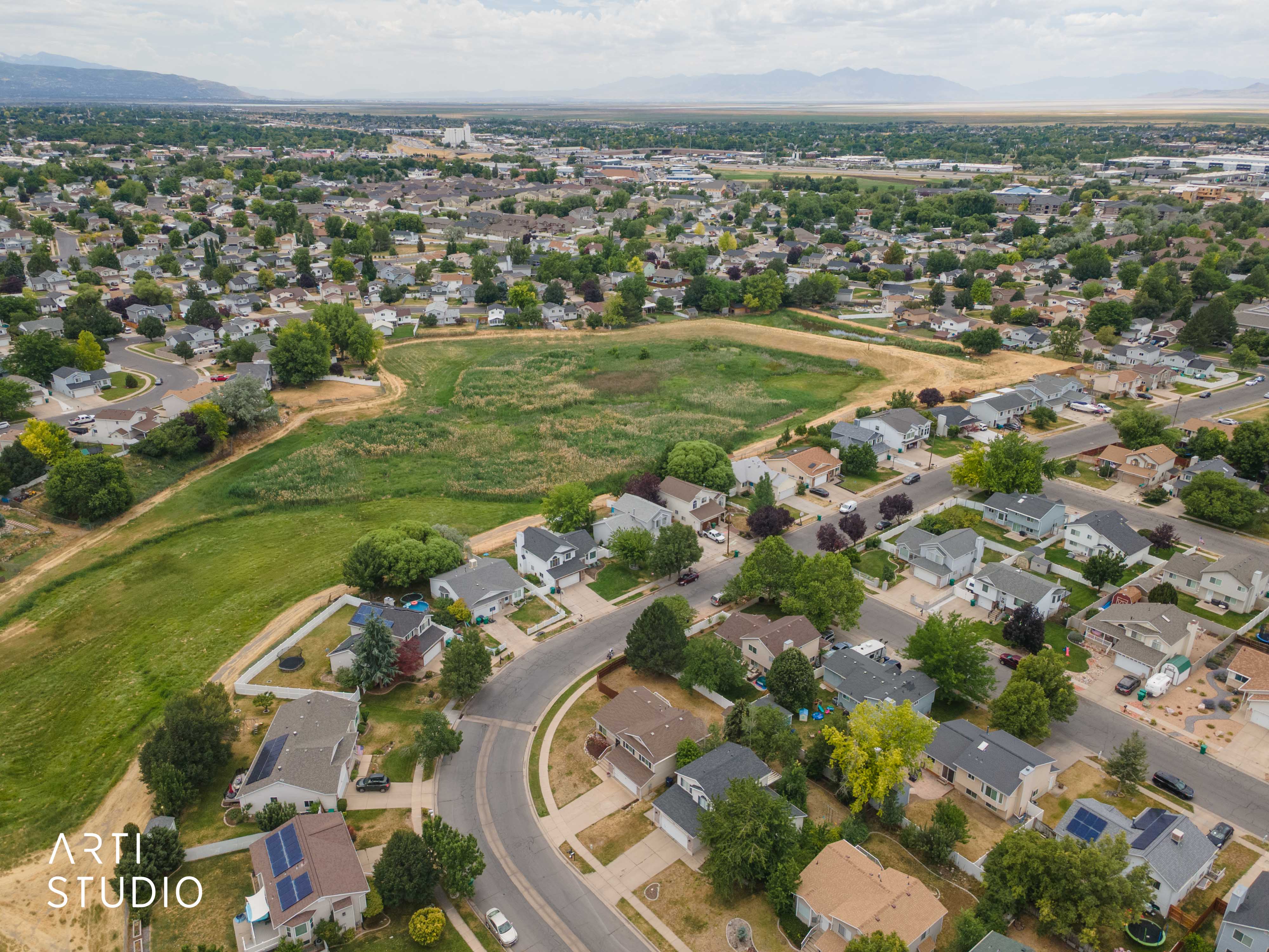 Residential neighborhood featuring a mix of one and two-story homes, many with solar panel installations
