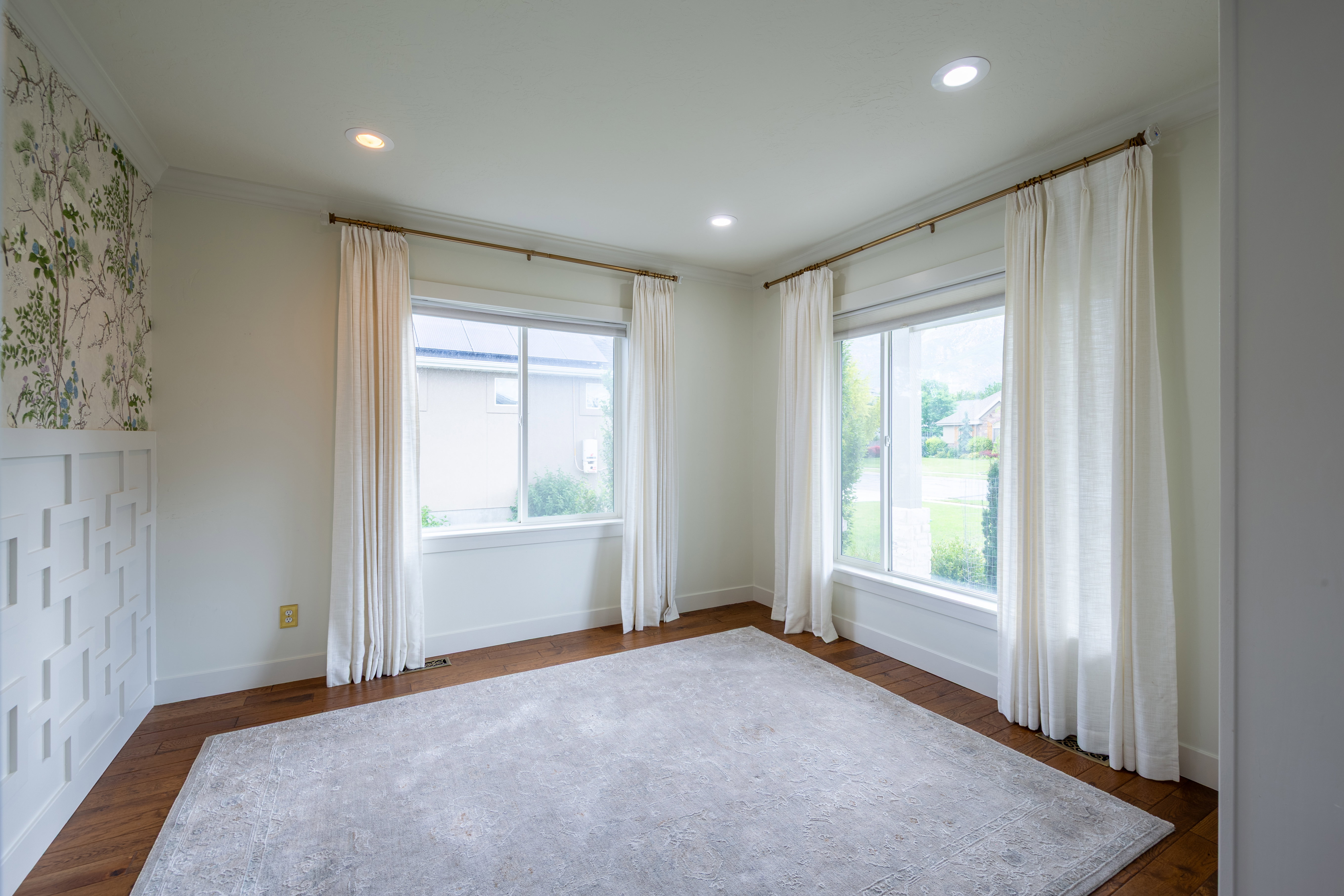 Bright interior space featuring wood-finish flooring, recessed lighting, and white trim
