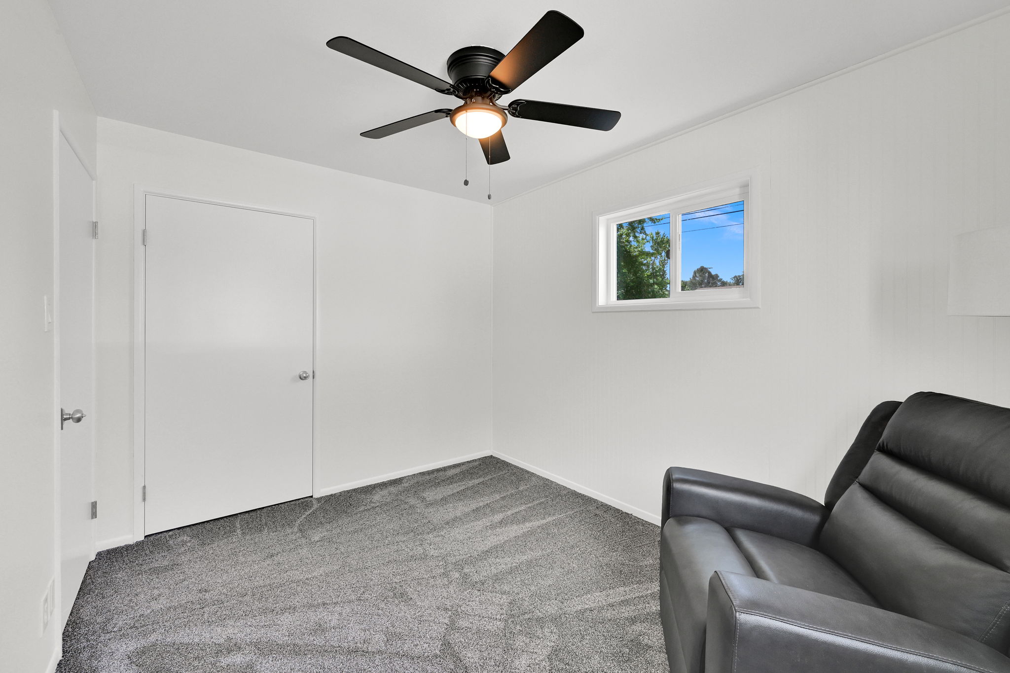 Room featuring neutral gray carpeting and white walls