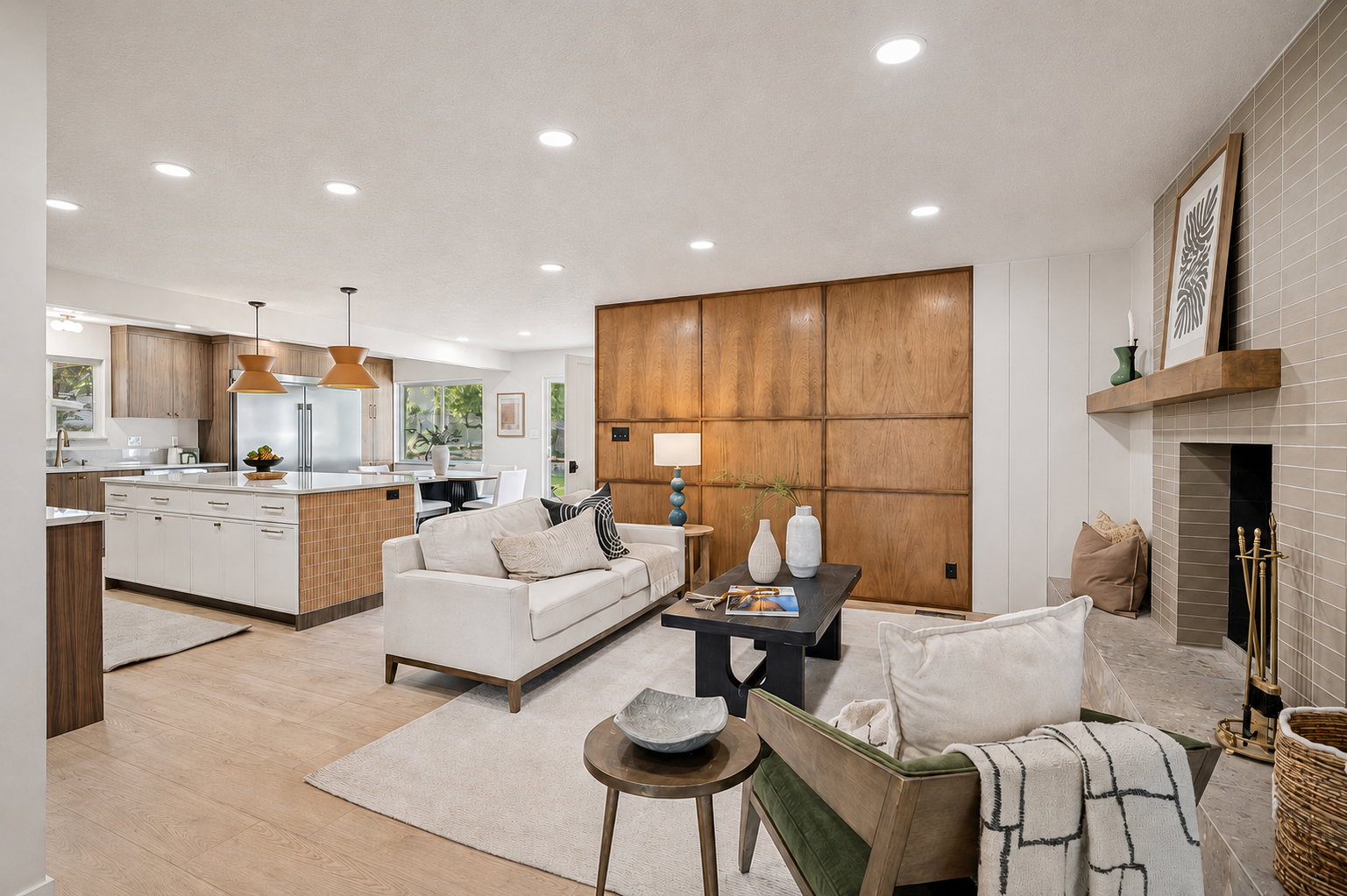 Open-concept living area with light wood-finish flooring