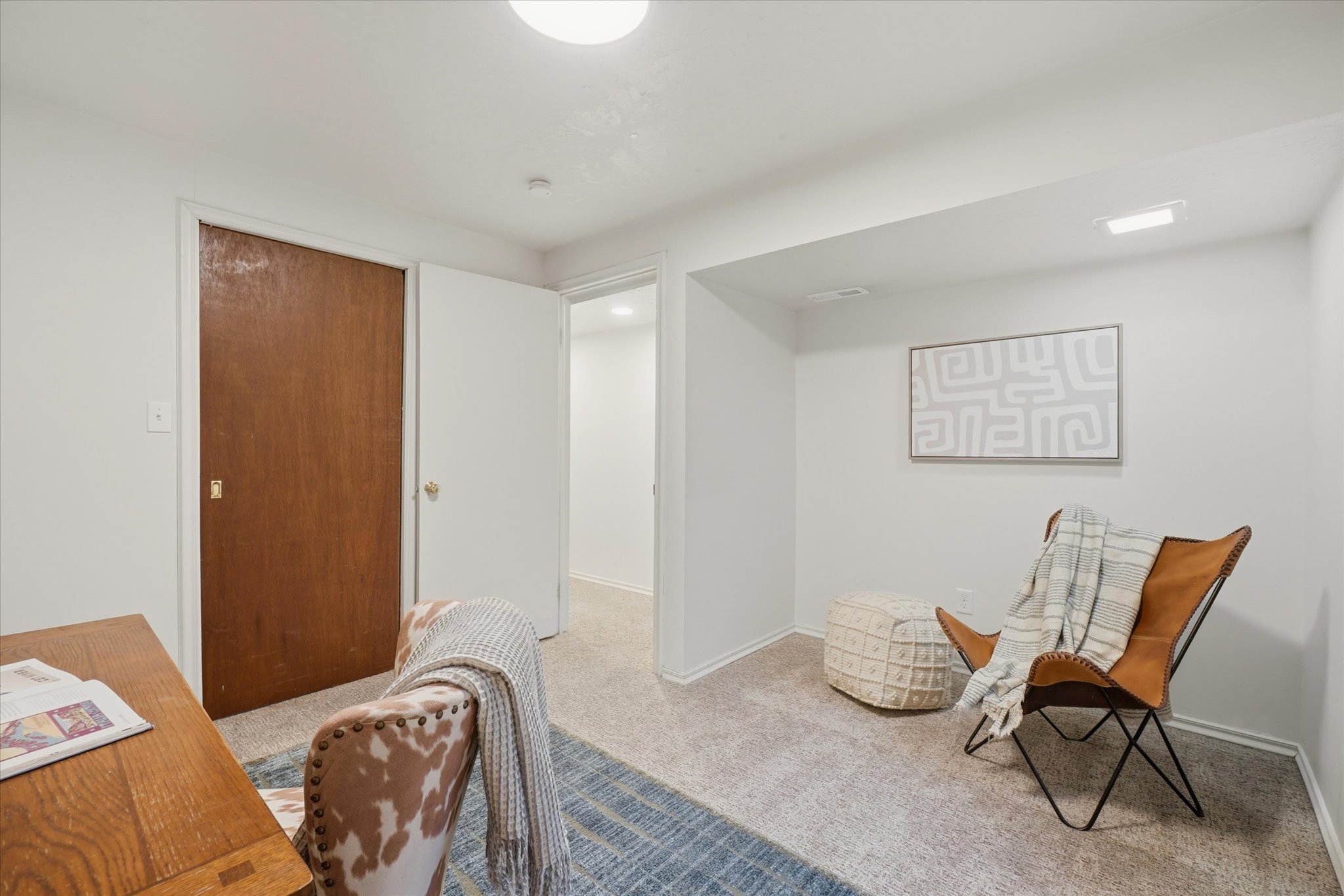 Carpeted room with white walls, a recessed light fixture, and a flush mount ceiling light