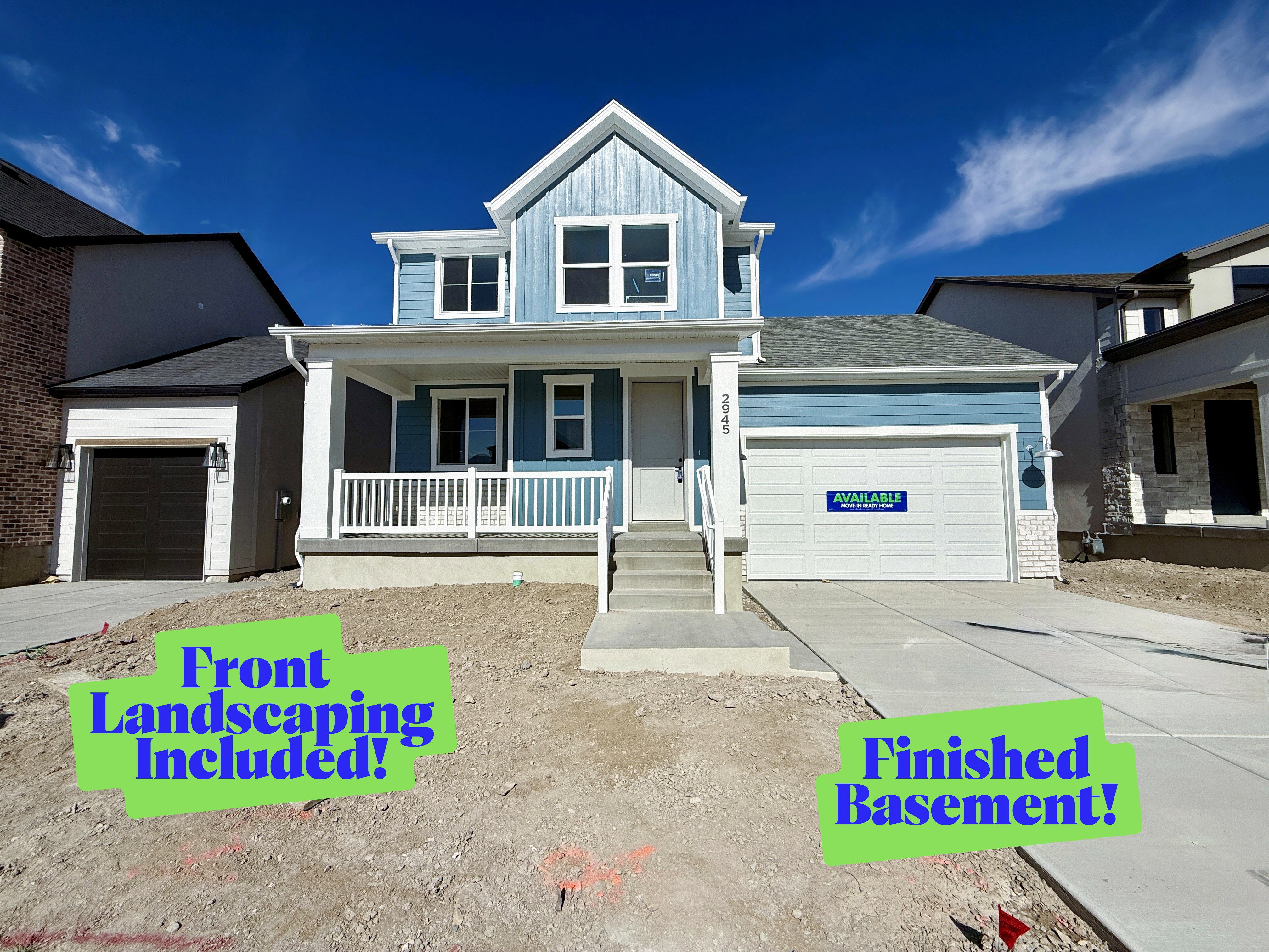 Contemporary two-story residence featuring blue siding and white trim