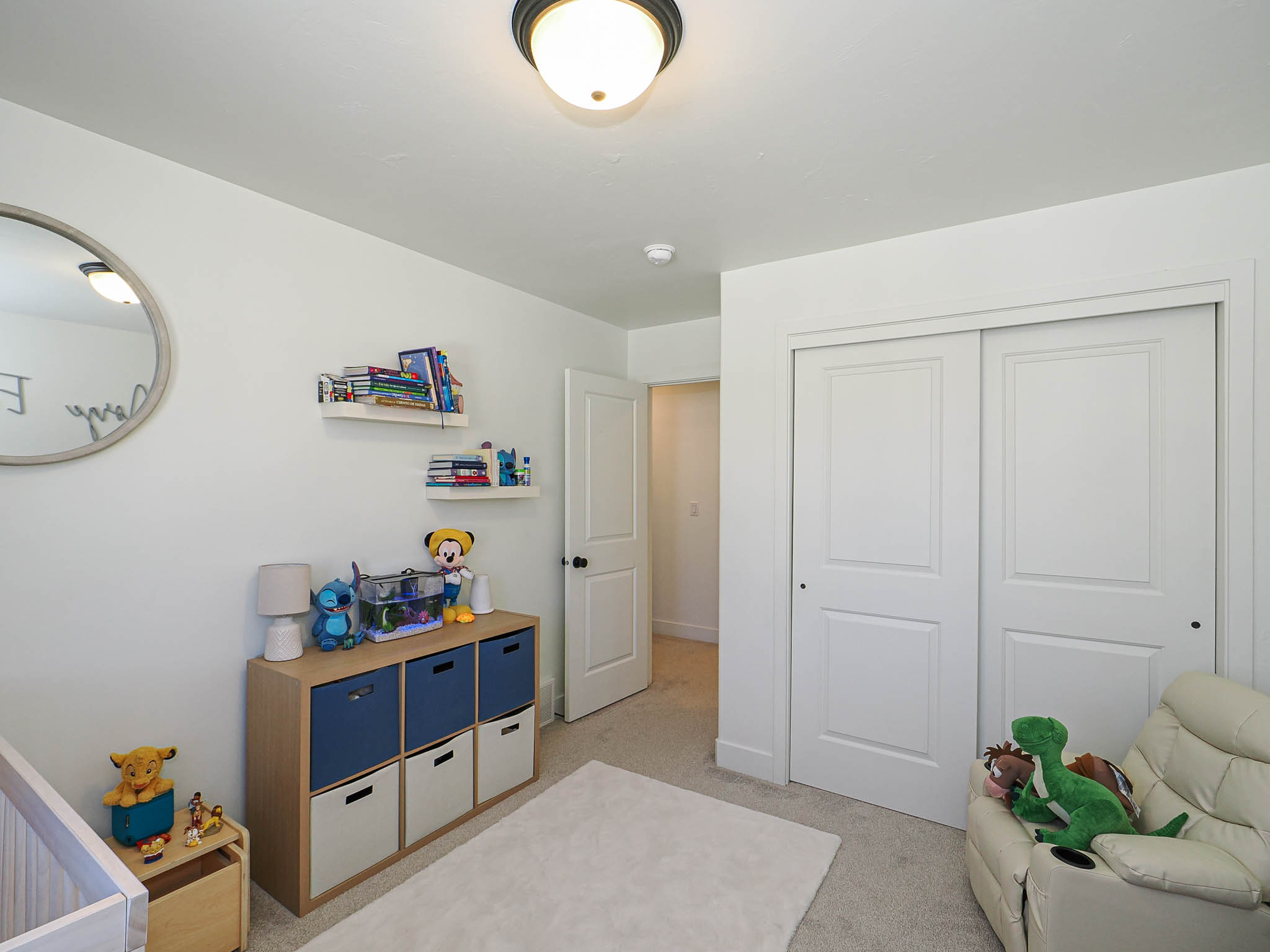 Room featuring light-colored walls and carpeted flooring