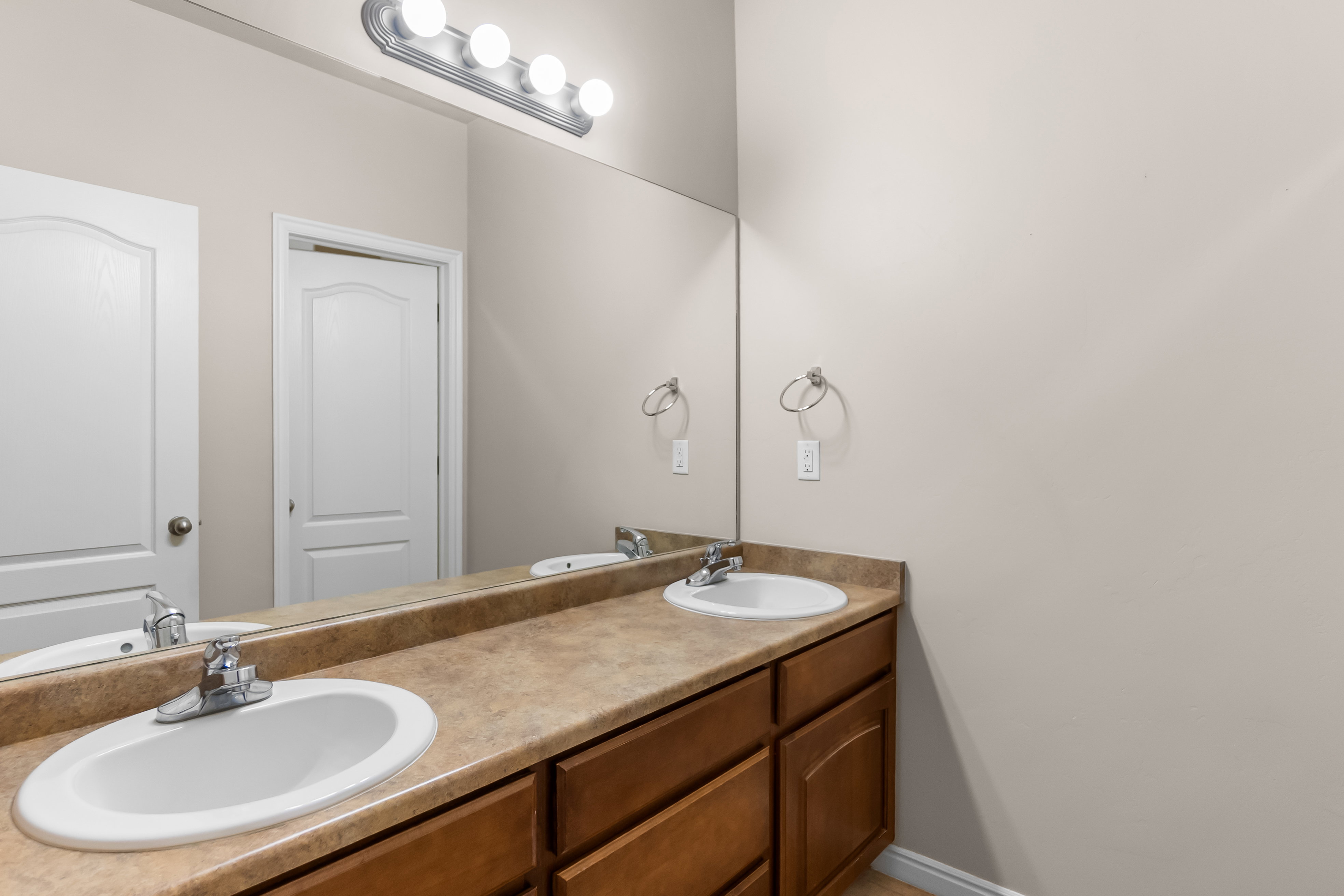 Dual undermount sinks set within a spacious countertop