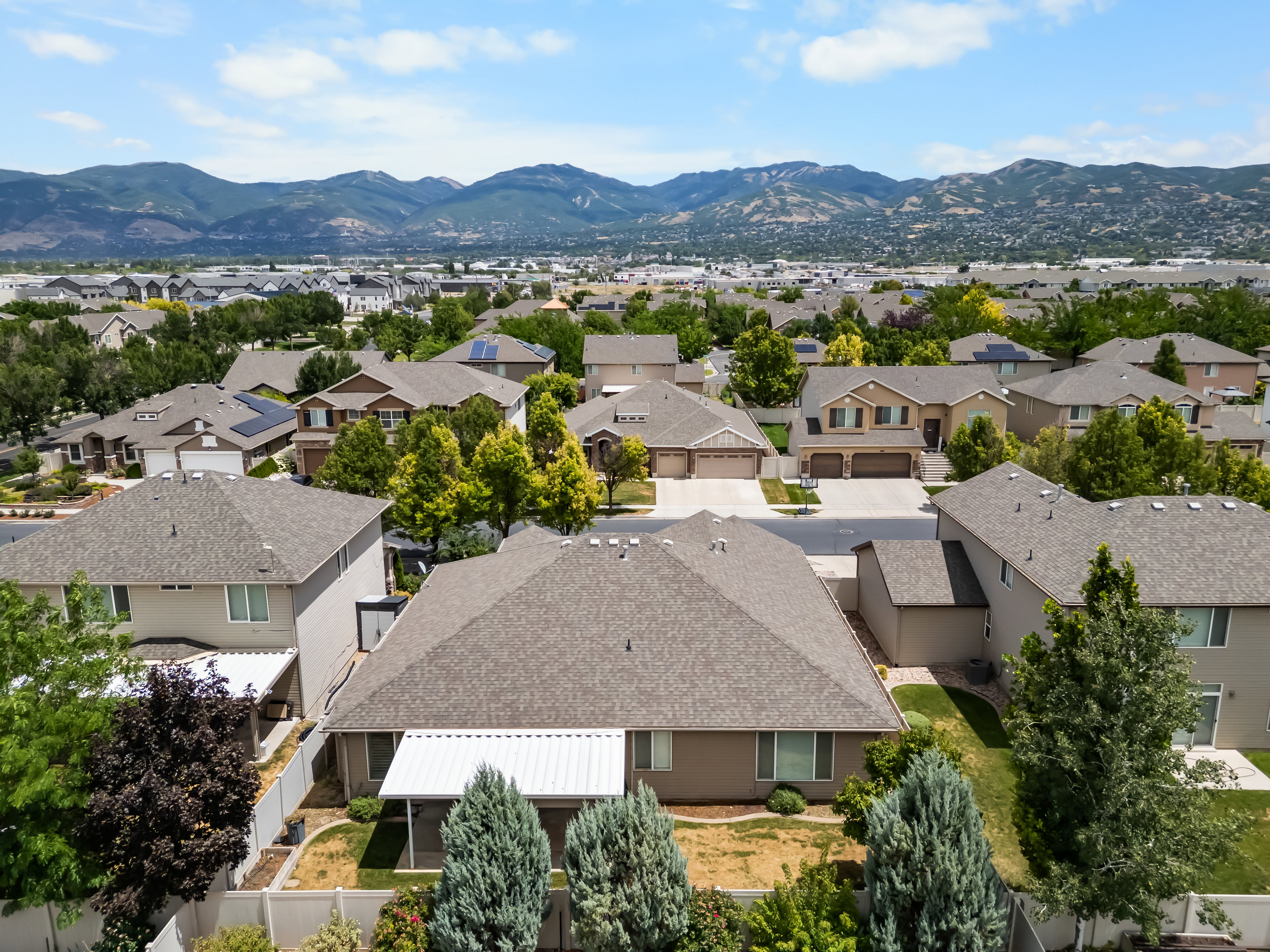 Residential area with a mountain backdrop, featuring a variety of housing styles