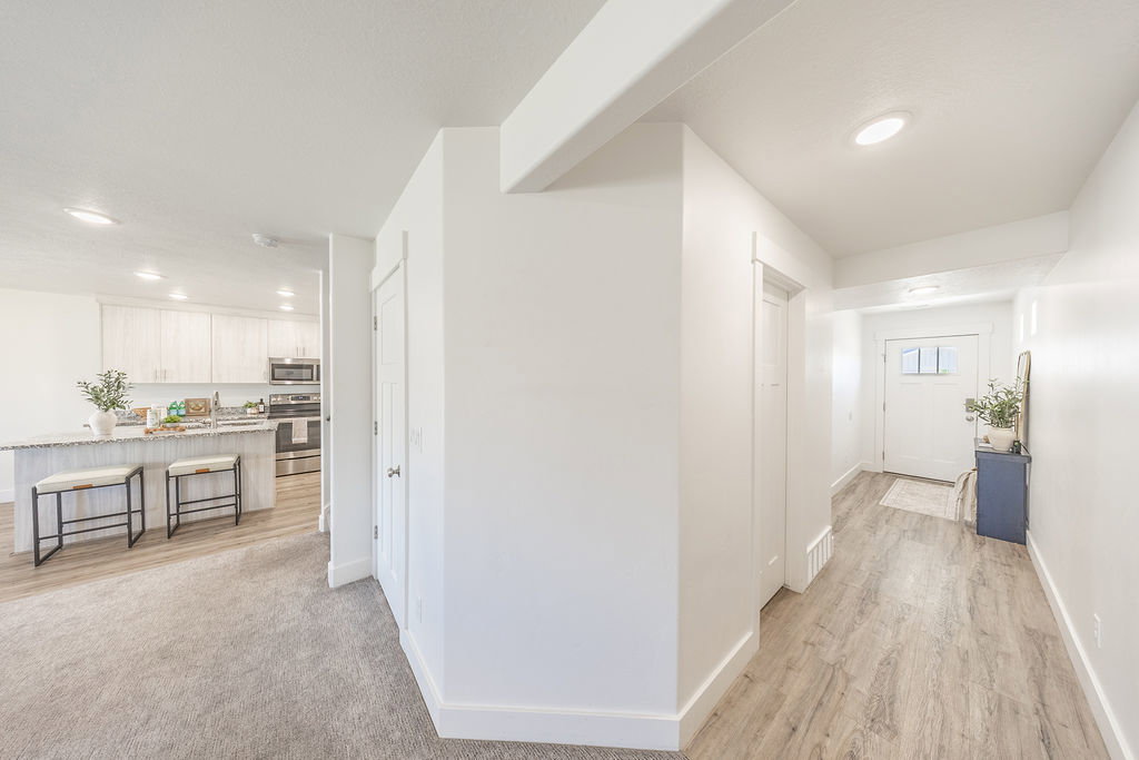 View to front door hallway and toward kitchen.