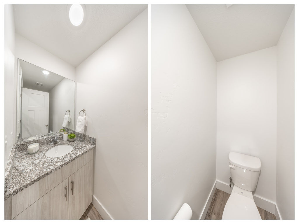 Powder room featuring a single vanity with a granite-style countertop, undermount sink, and light wood-finish cabinetry