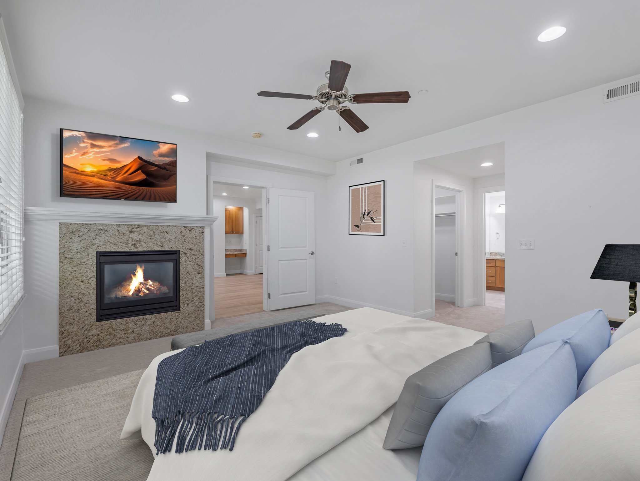Bedroom featuring a built-in fireplace with a stone surround and mantel