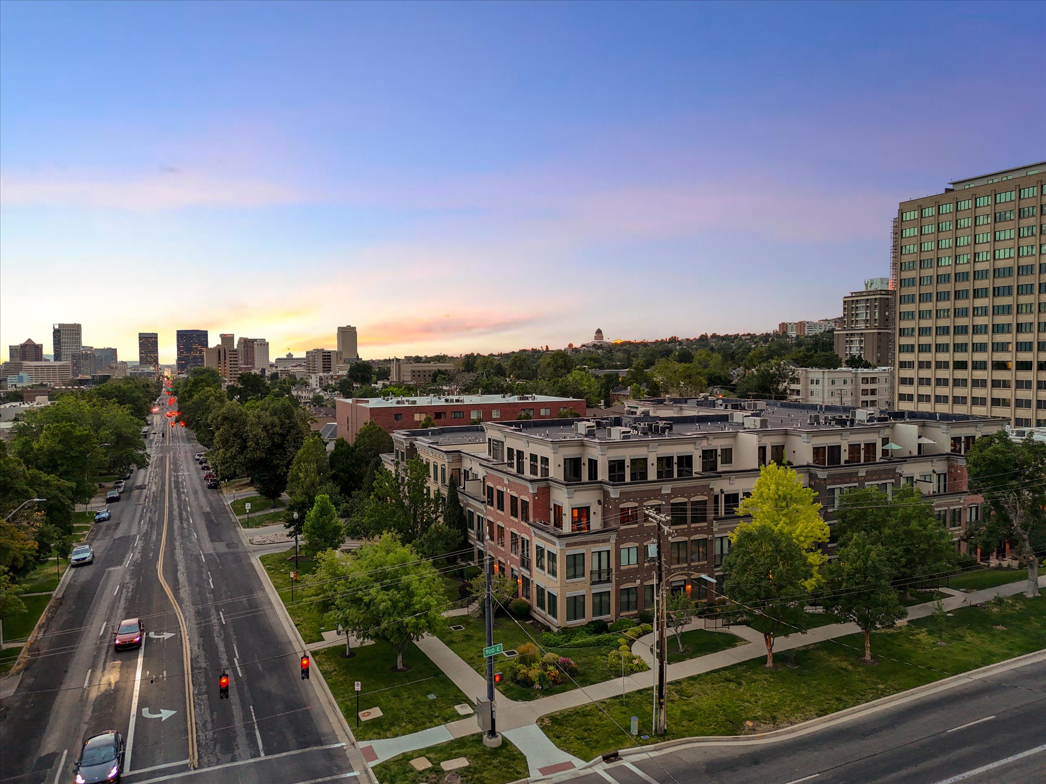 Mixed-use residential and commercial complex featuring brick and light-toned facade elements