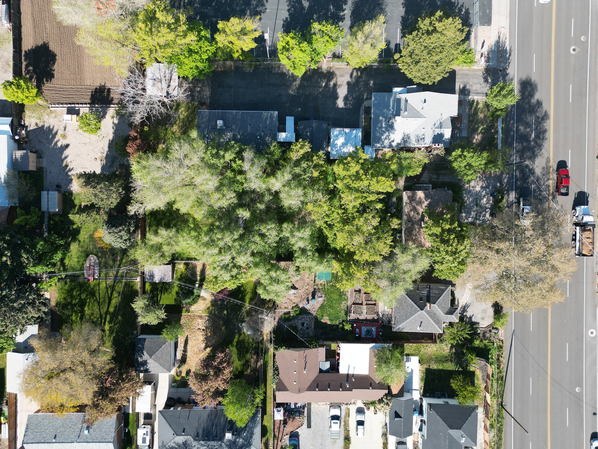 Aerial perspective showcasing a residential property with established trees