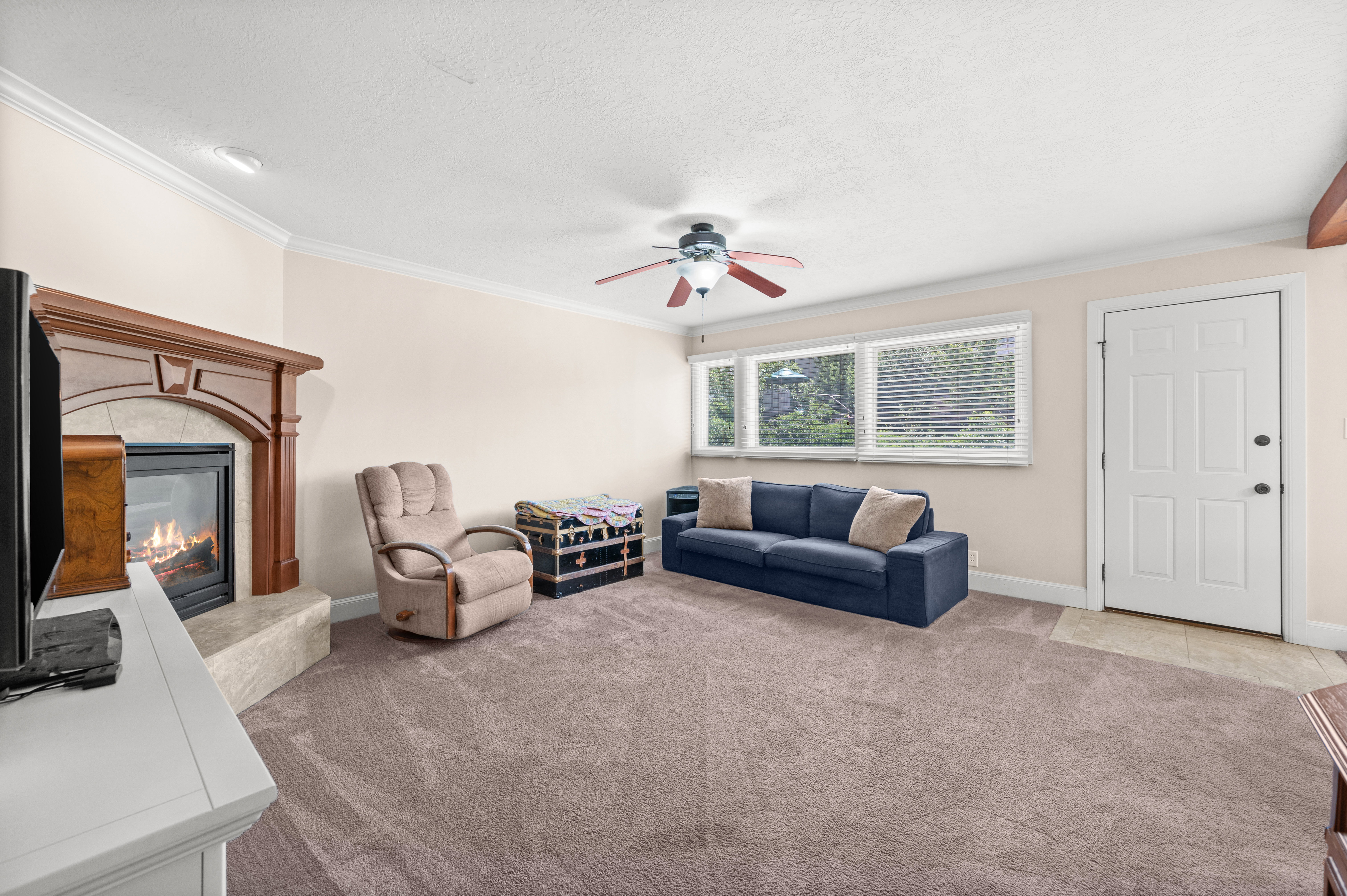 Whether hosting a summer barbecue or enjoying a peaceful evening outside, this family room creates a seamless connection to the outdoors.