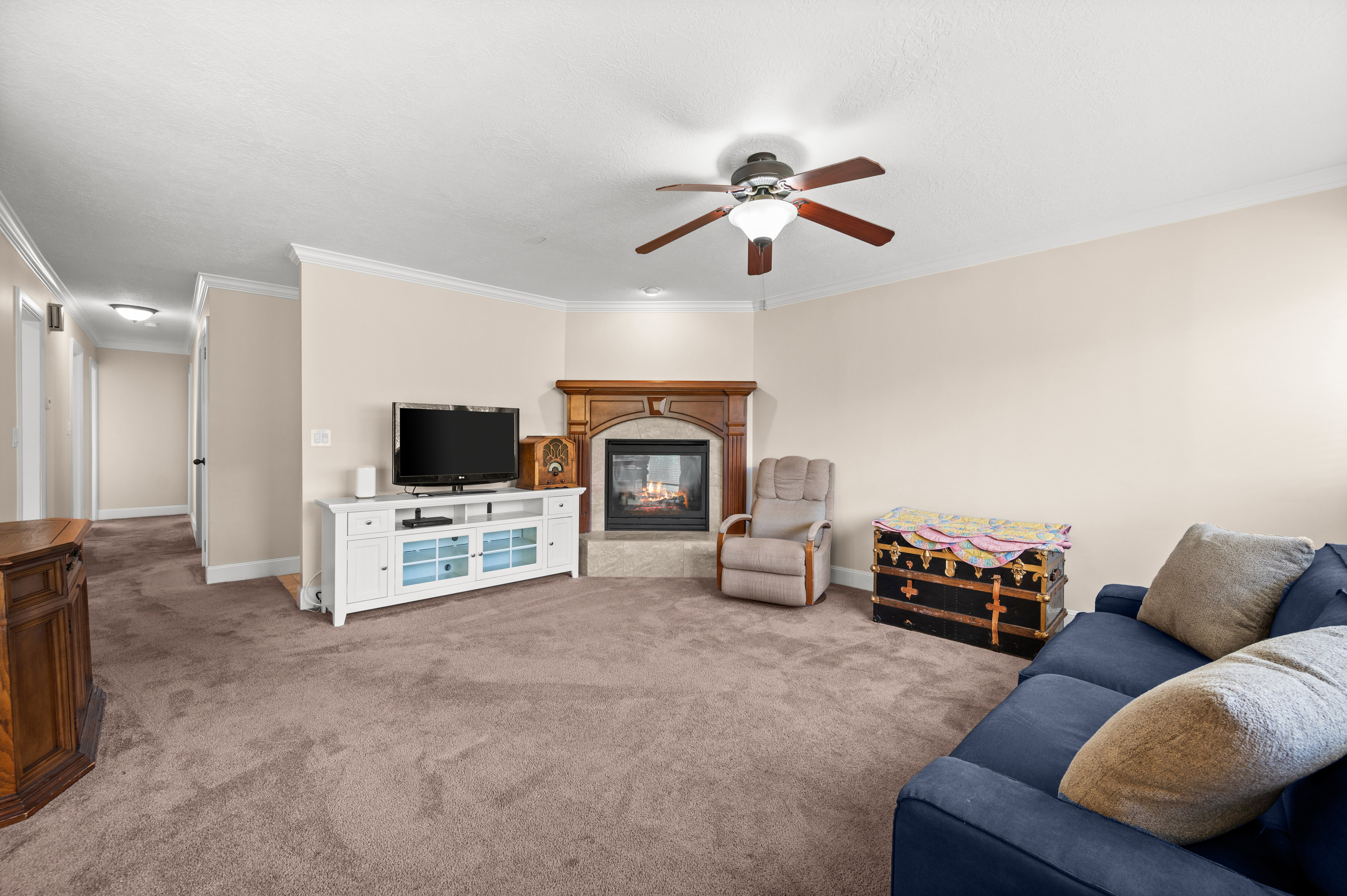 The gas fireplace creates a warm focal point, making this large family room the perfect place to gather year-round.