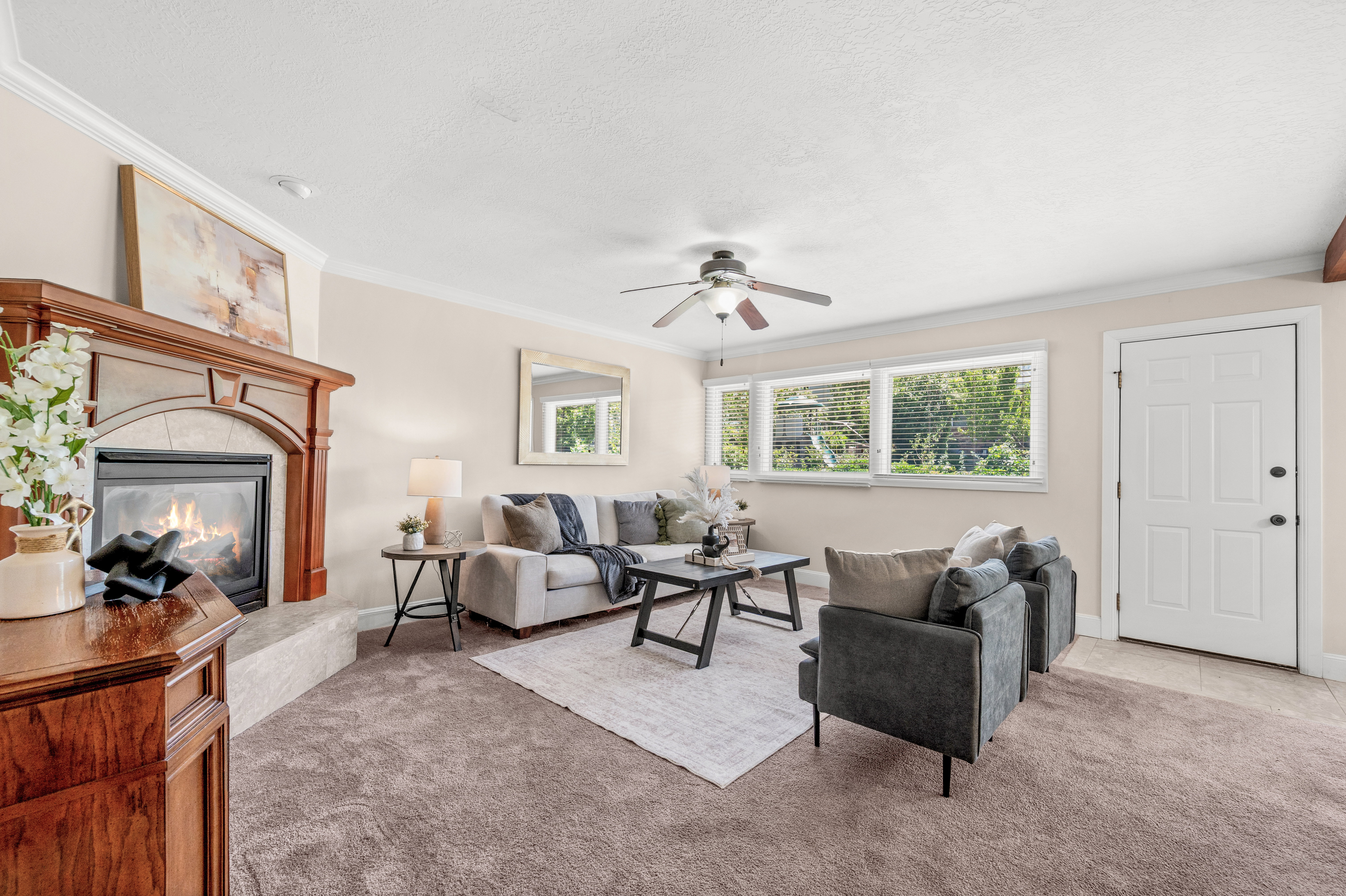 Whether hosting a summer barbecue or enjoying a peaceful evening outside, this family room creates a seamless connection to the outdoors.