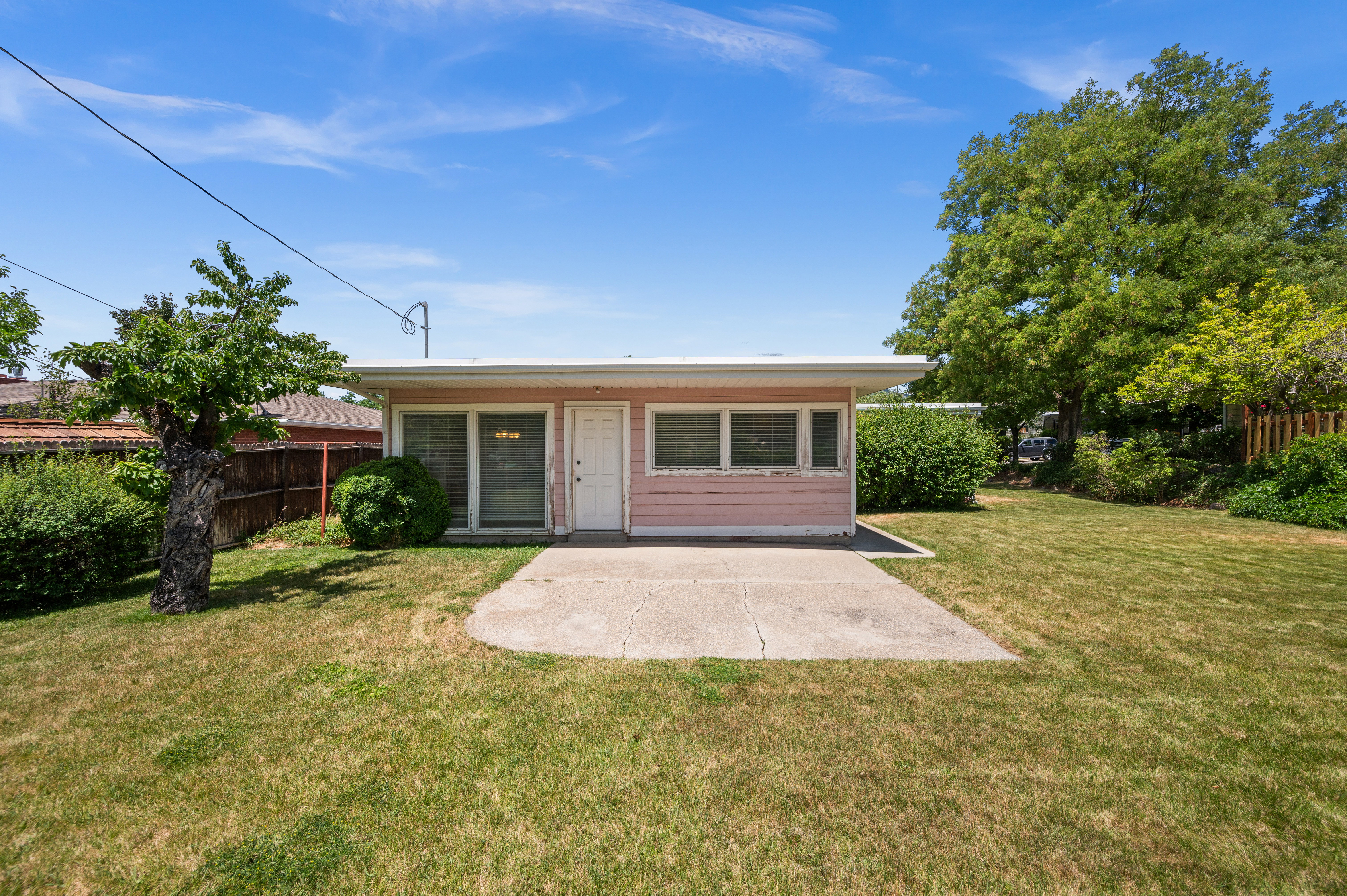 This expansive backyard offers endless possibilities for family fun, outdoor dining, and making memories for years to come.