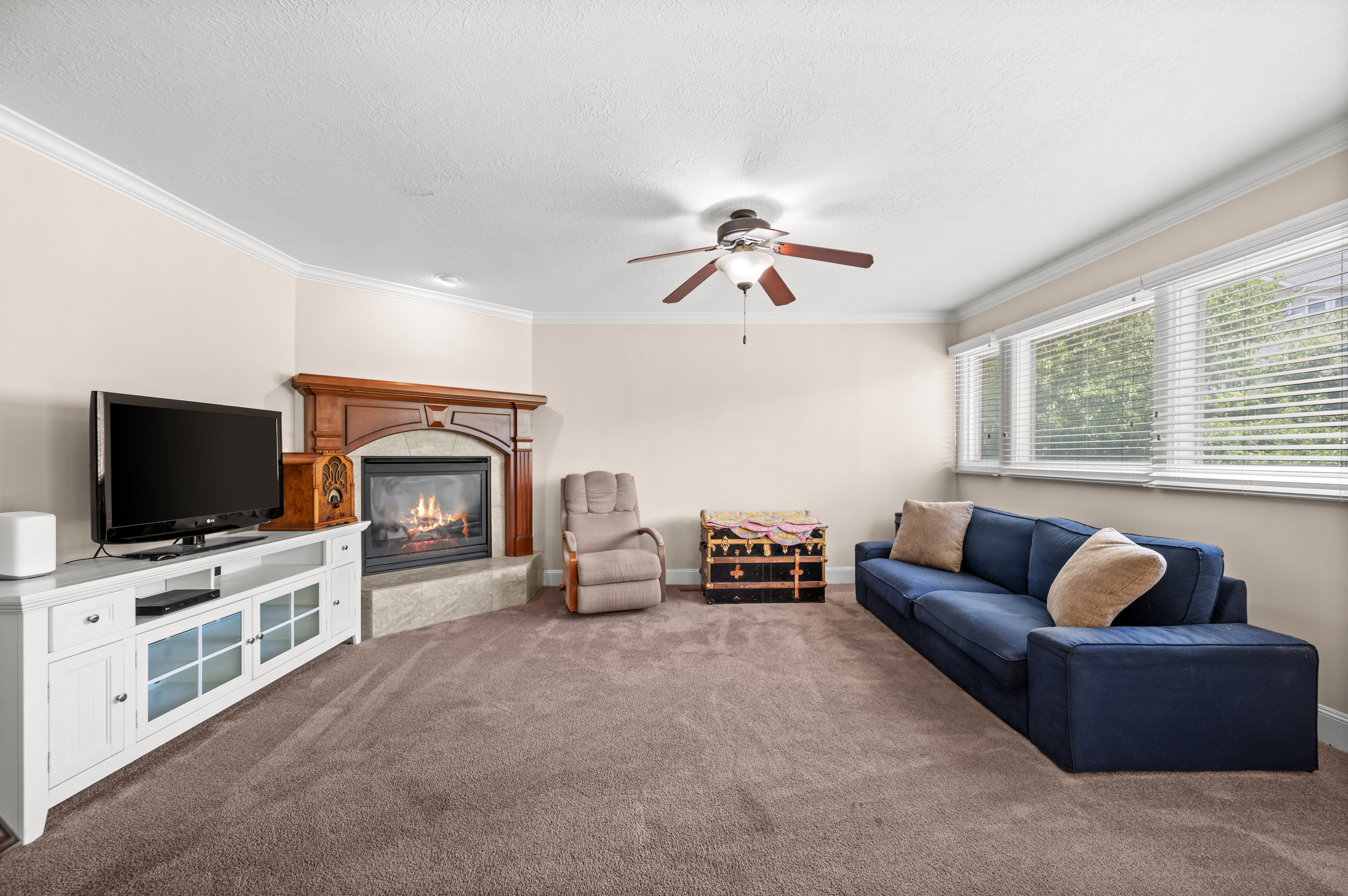 Whether it's movie nights, holiday gatherings, or quiet evenings by the fire, this spacious family room is designed to bring family and friends together and create memories for years to come.