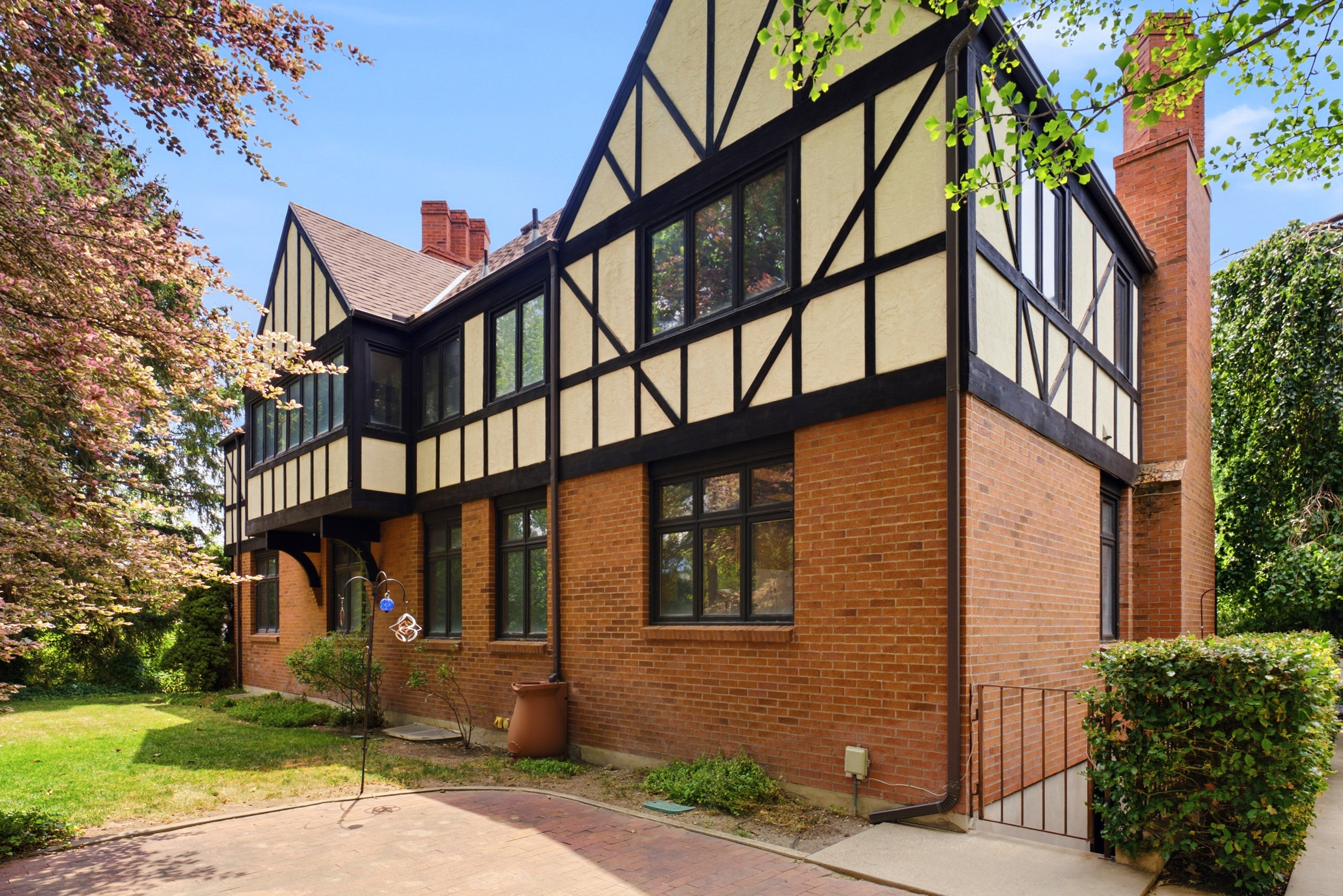 Tudor-style architecture featuring brick veneer and exposed timber framing