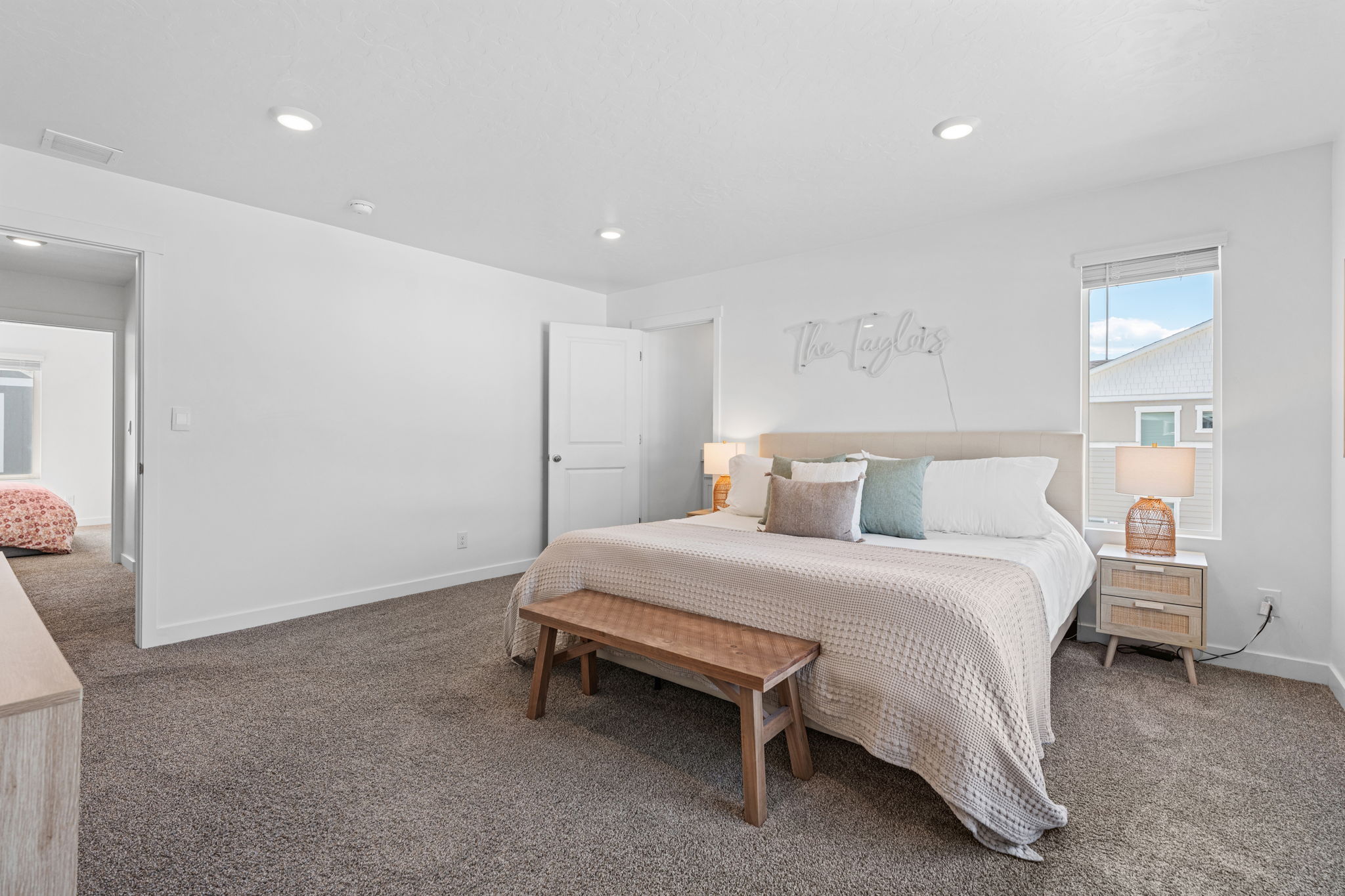 Spacious primary bedroom 1. Can lights. Large windows. Primary ensuite and walk in closet.