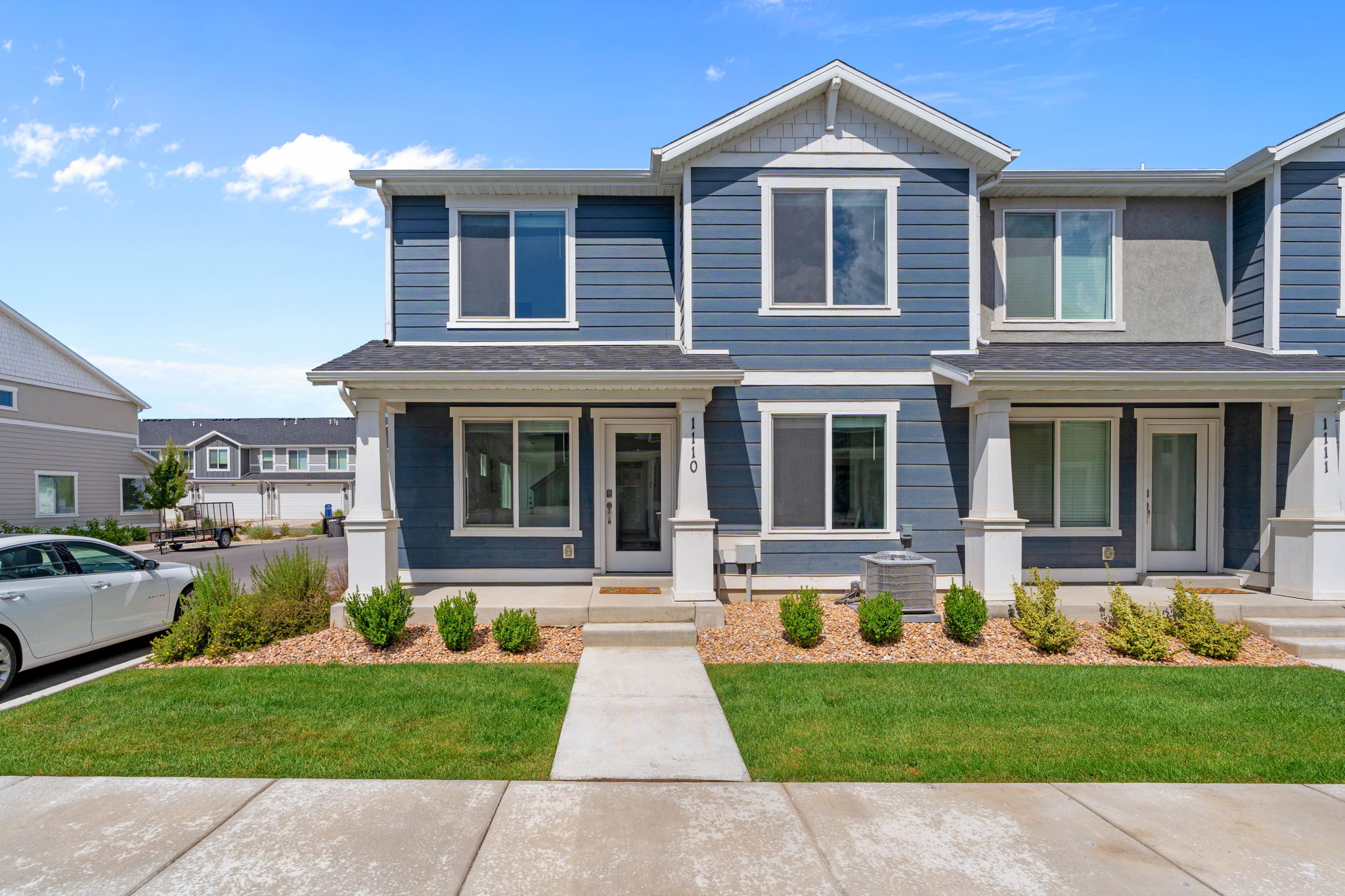 2 Story Townhome. End Unit. Lovely blue hardyboard siding. Porch. Front door and back entrnaces! Lots of parking, including in the driveway. 2 car garage.