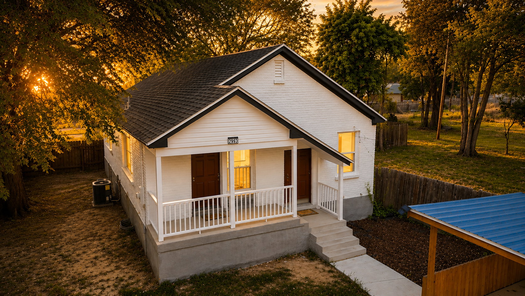 White brick and siding exterior with a dark shingle roof