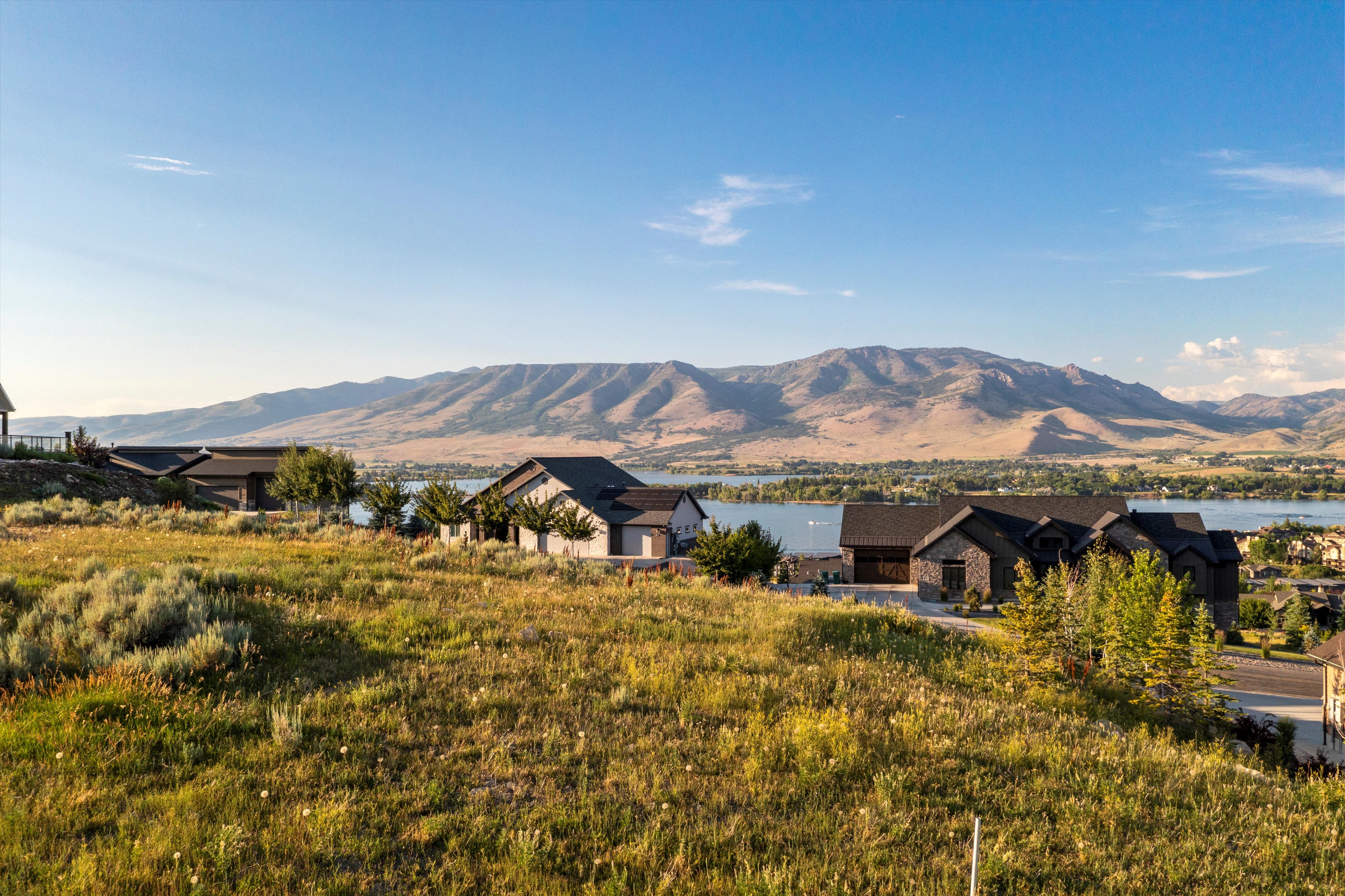 Expansive elevated lot featuring natural landscaping and mountain scenery