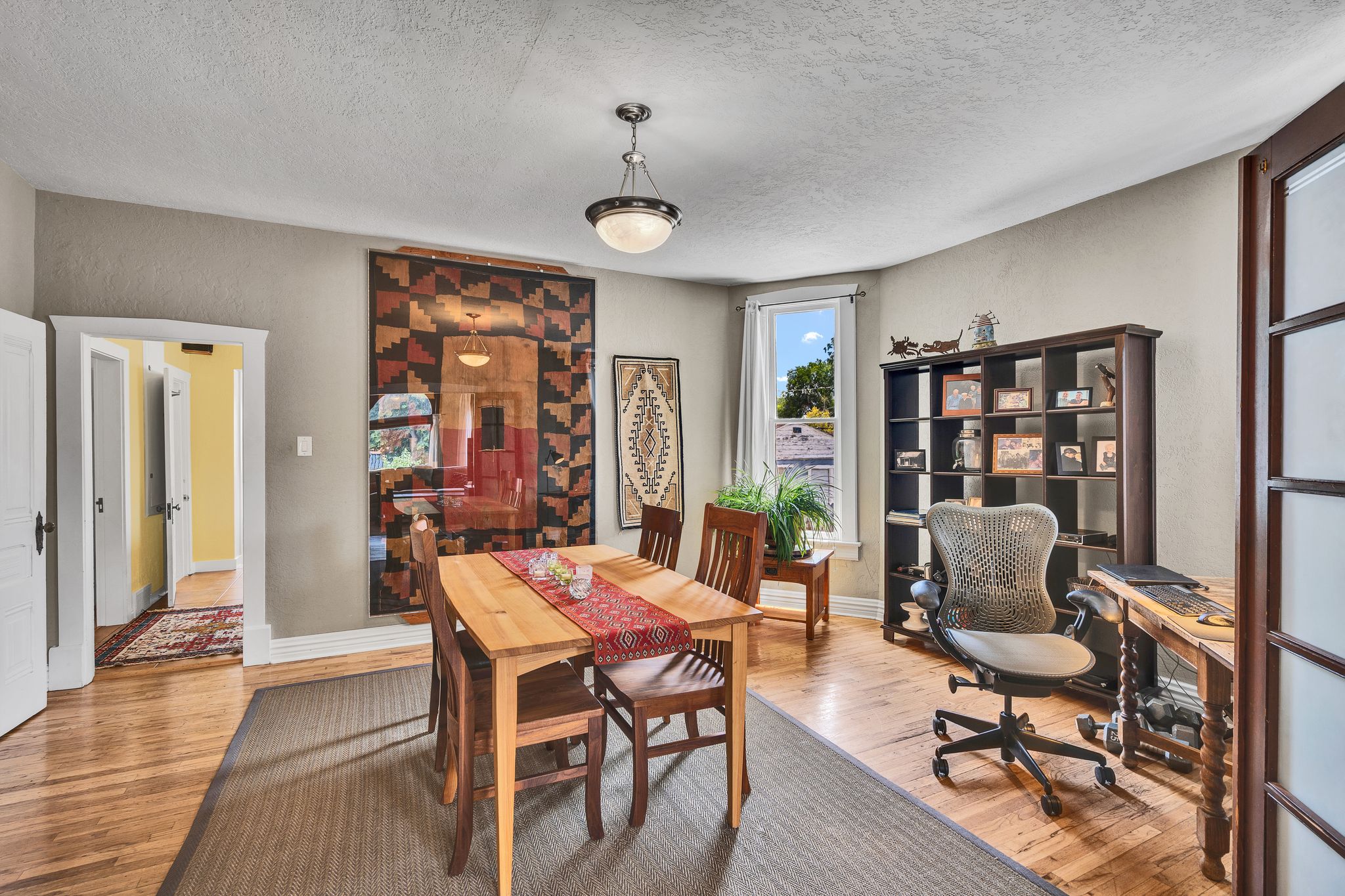 Hardwood floors,  bay  windows with natural light, and lots of natural light.