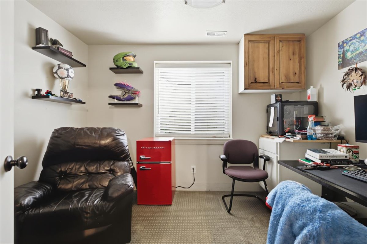Room featuring light-colored walls and carpet flooring