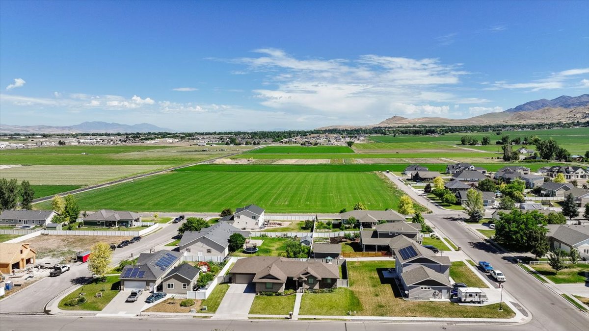 Expansive green fields bordering a residential neighborhood