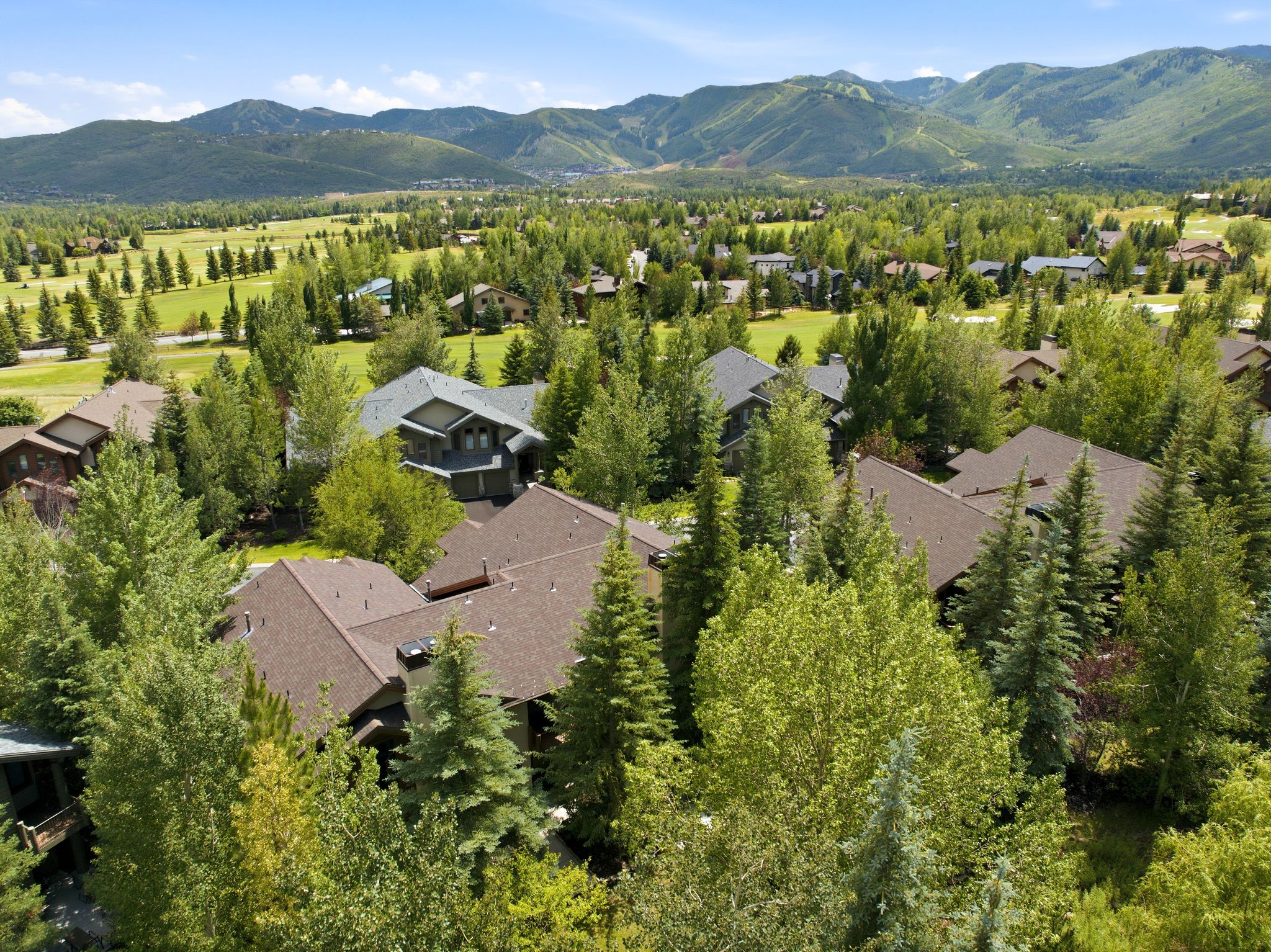 Expansive mountain landscape featuring a sprawling residential area