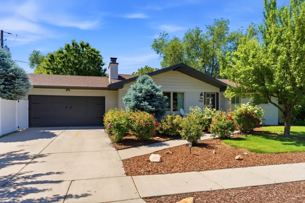 Single-story residence featuring a two-car garage with a concrete driveway