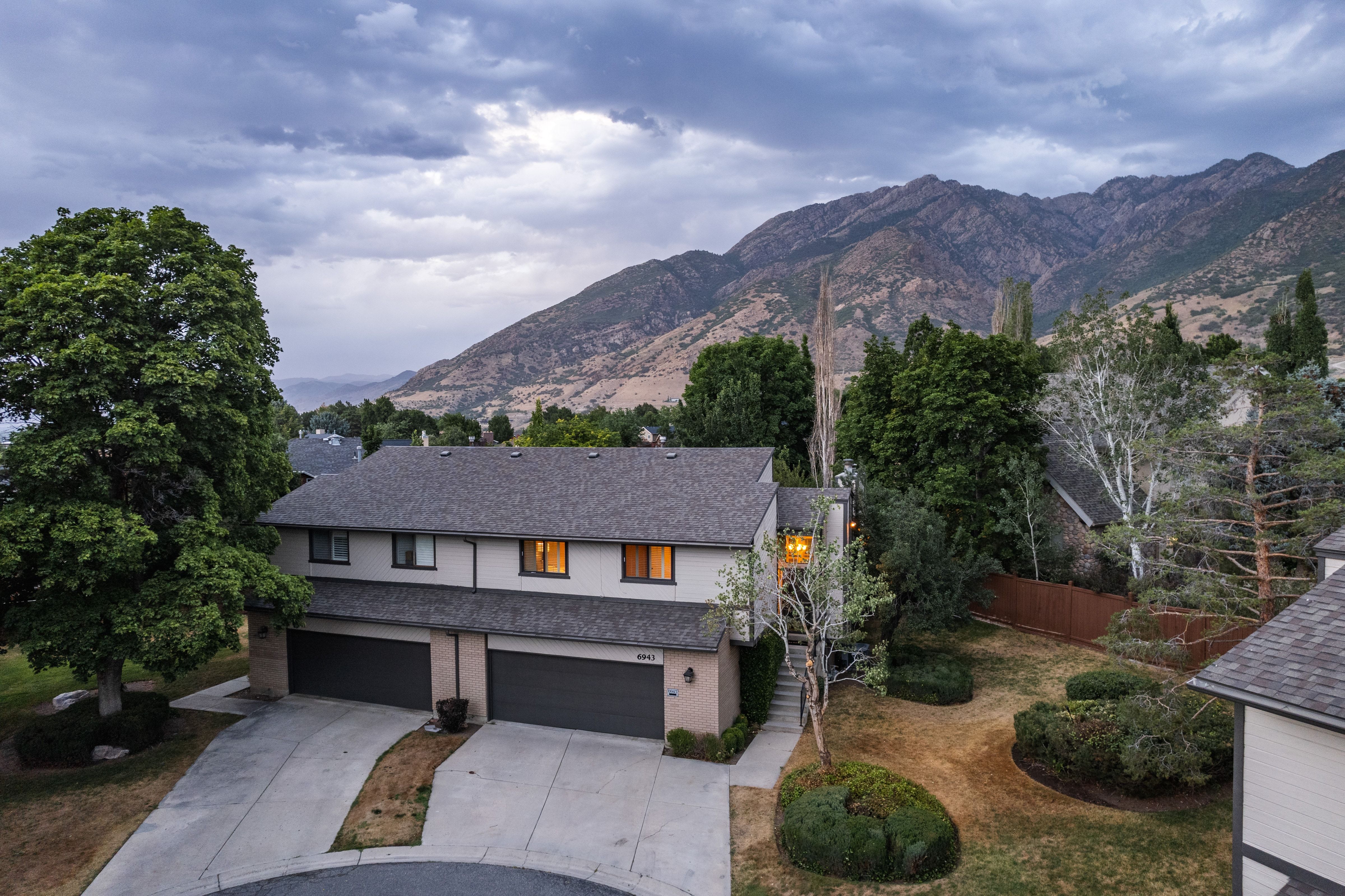 Townhome exterior with a dual-car garage and concrete driveway