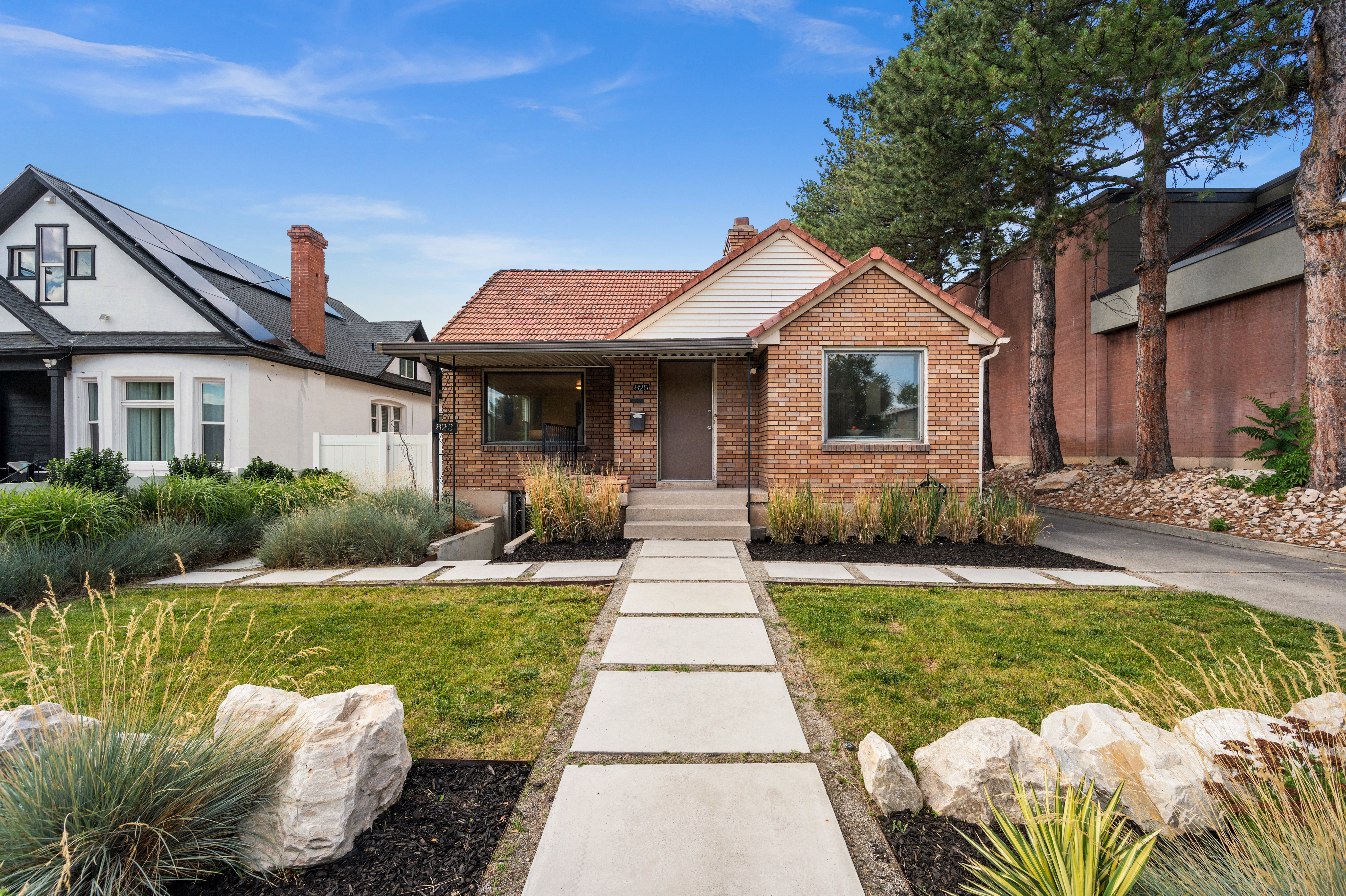 Brick exterior with a terracotta-style roof
