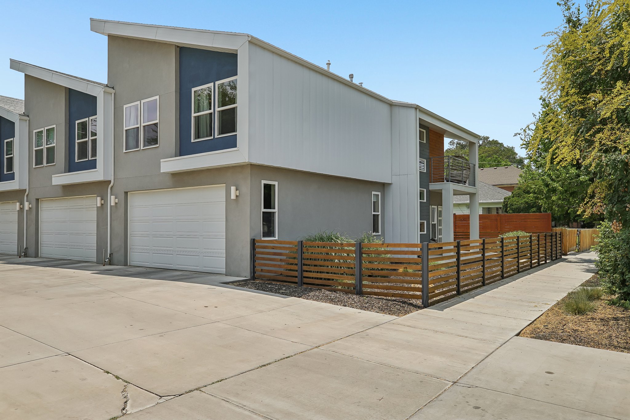 Contemporary multi-level exterior featuring a combination of stucco and horizontal siding