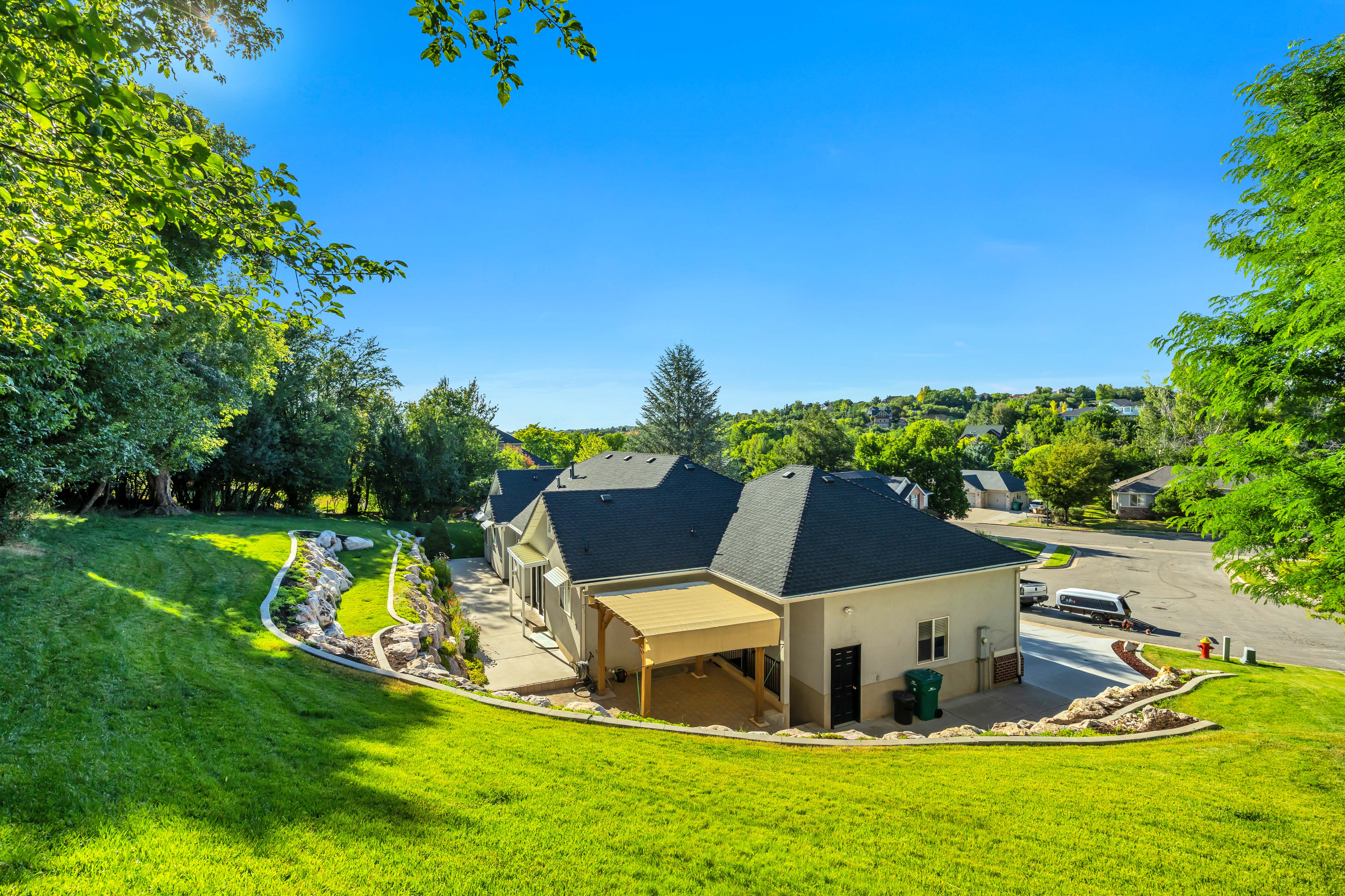 Expansive terraced lawn with rock retaining walls