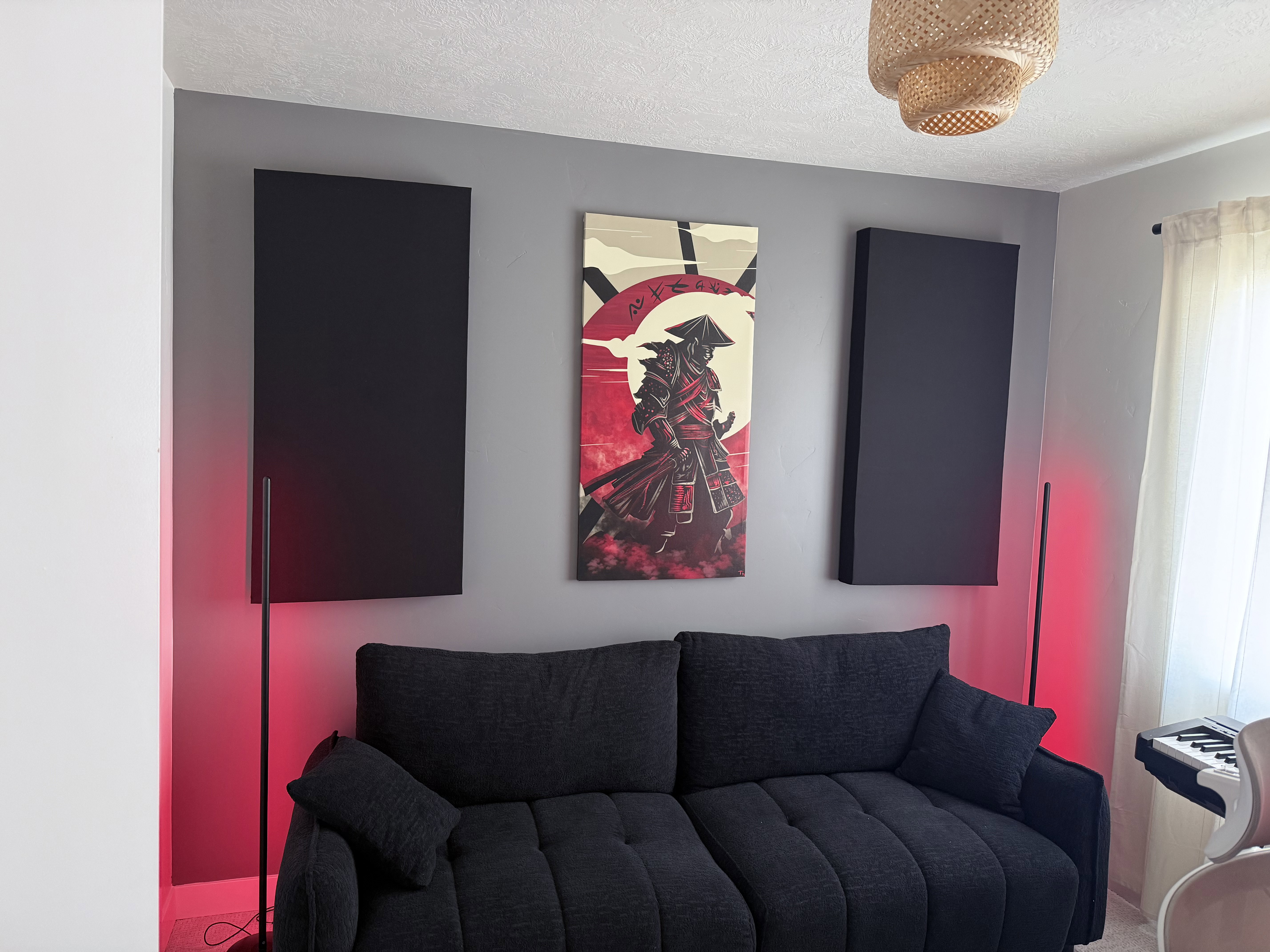 Textured wall panels with a woven light fixture and soft window coverings