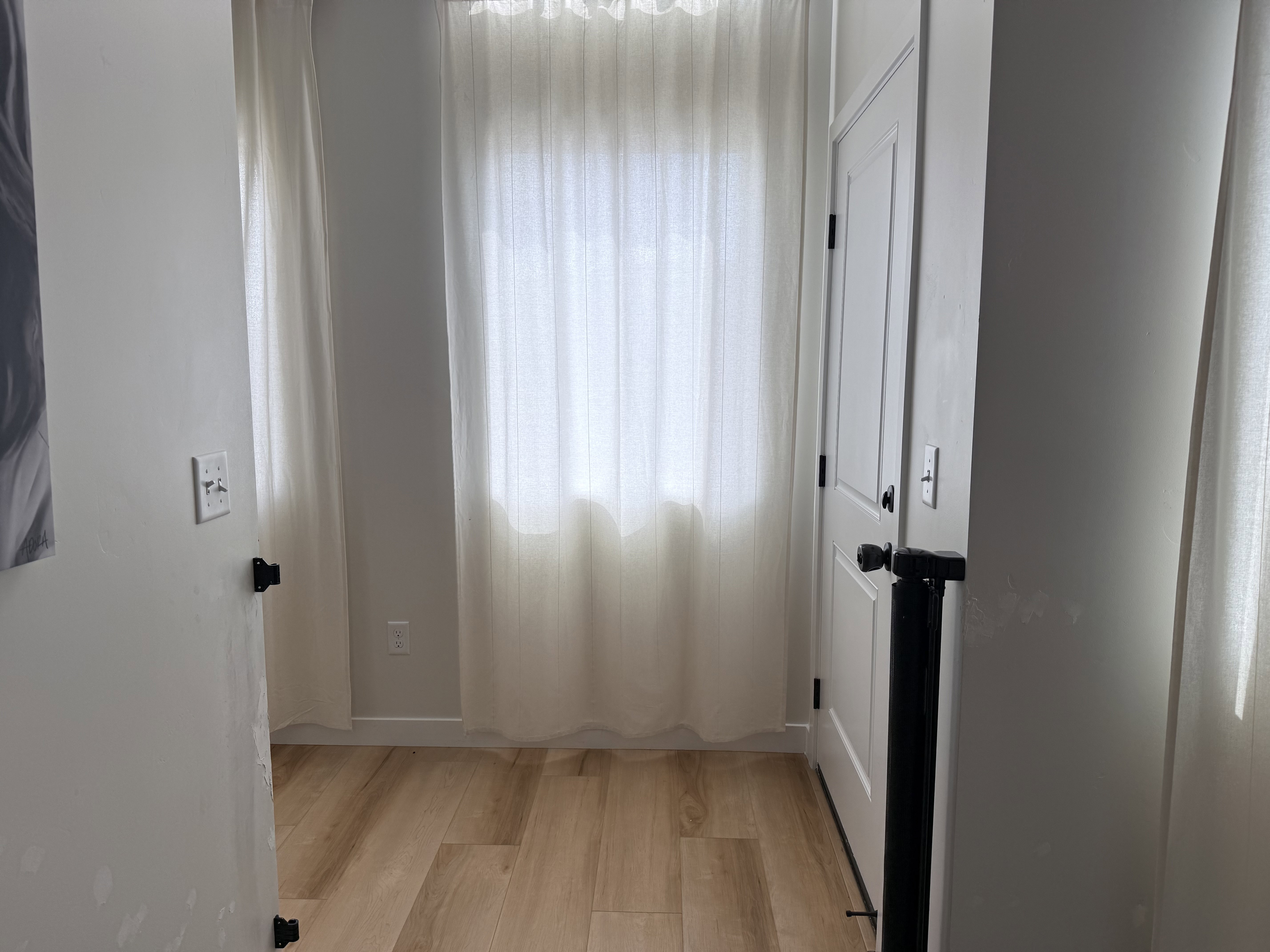 Light wood-finish flooring extending throughout the space