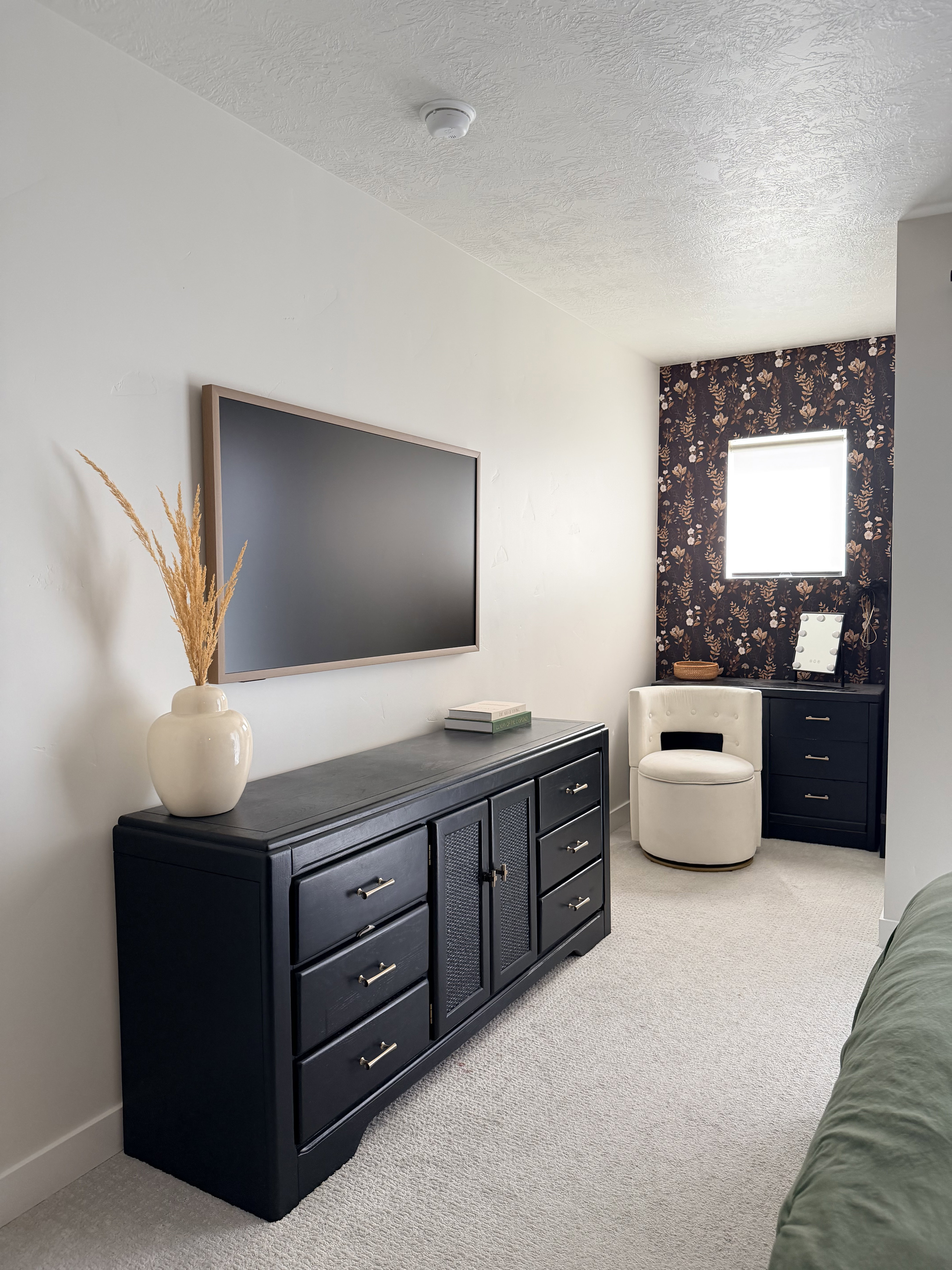 Neutral-toned carpeting extends throughout this interior space