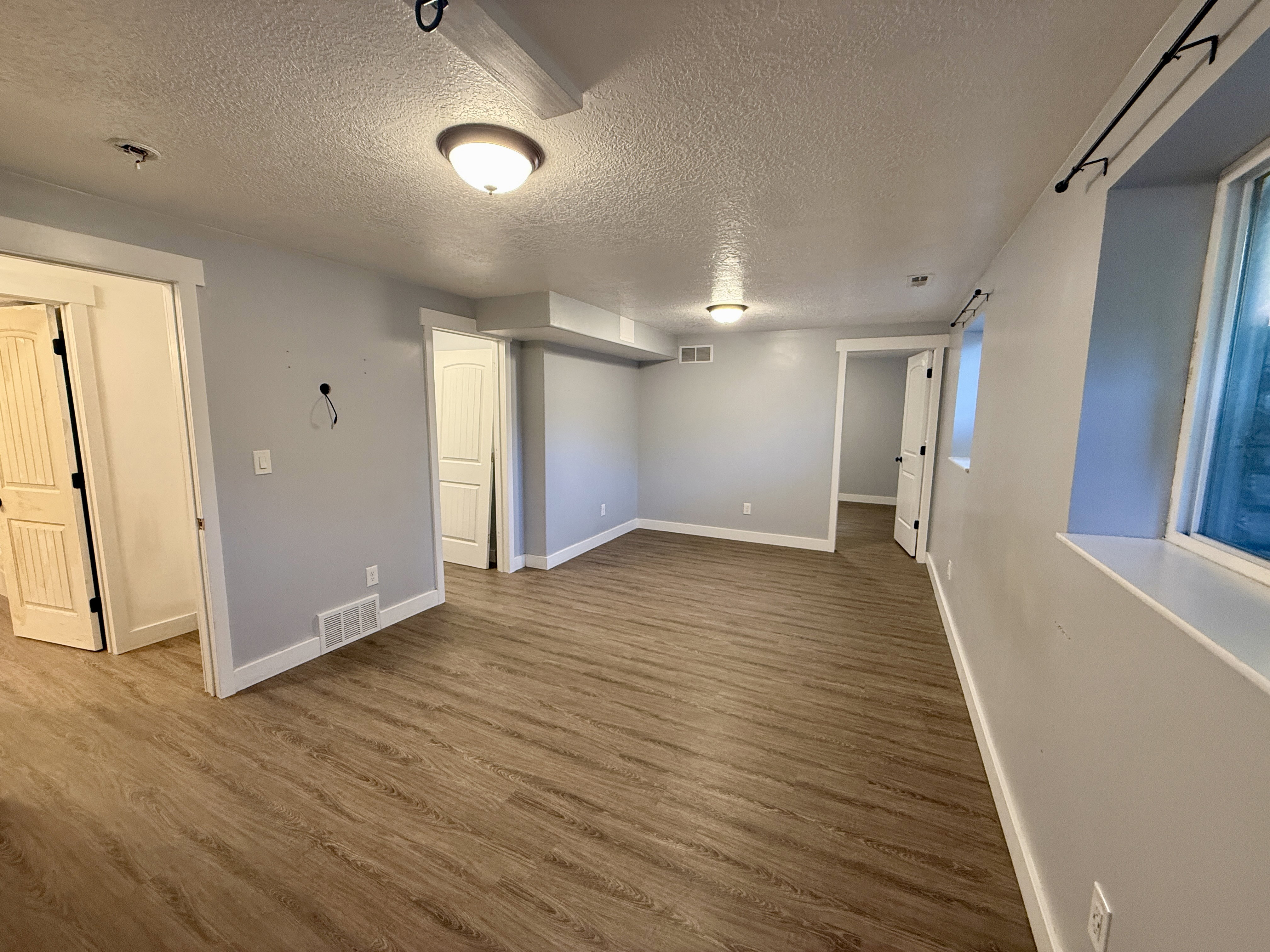 Basement bedroom suite with walk in closet, bathroom and private/office or sitting