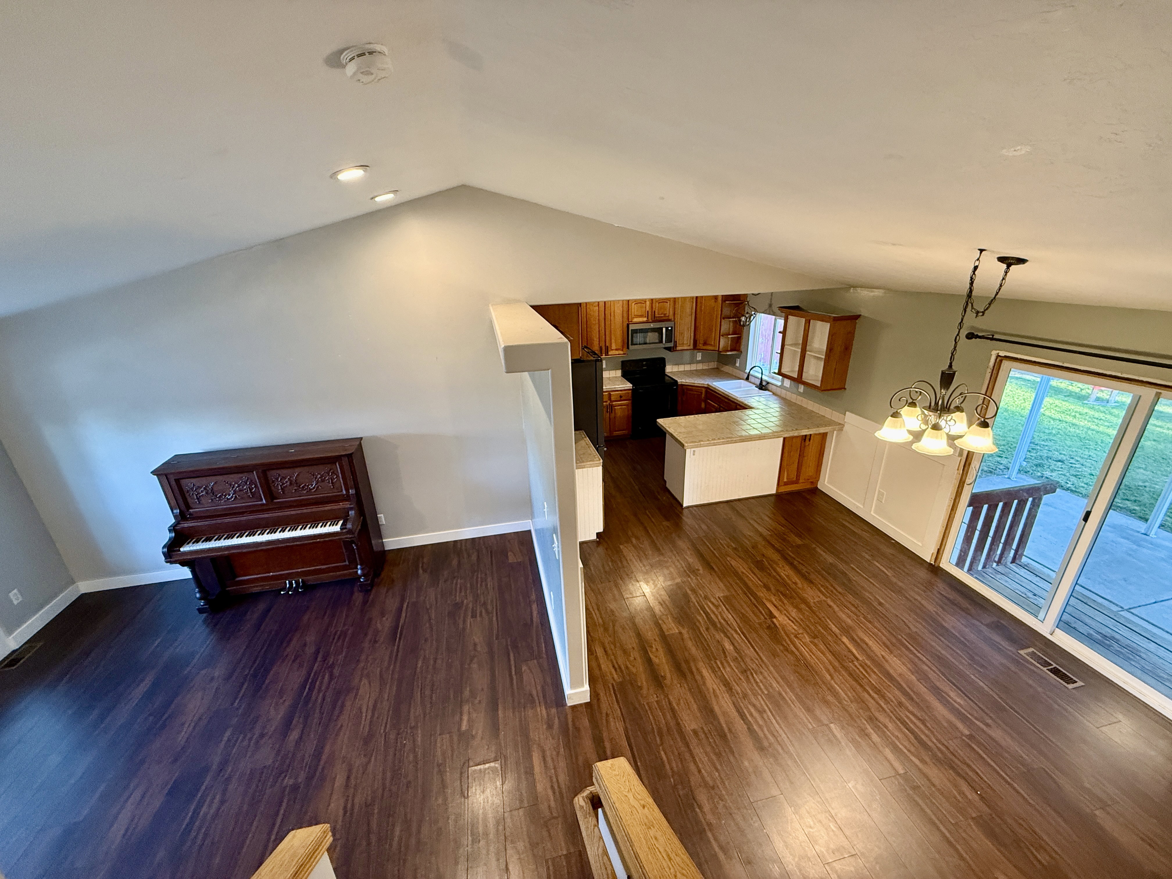 view from the stairs of the Formal sitting room and kitchen/dinning area
