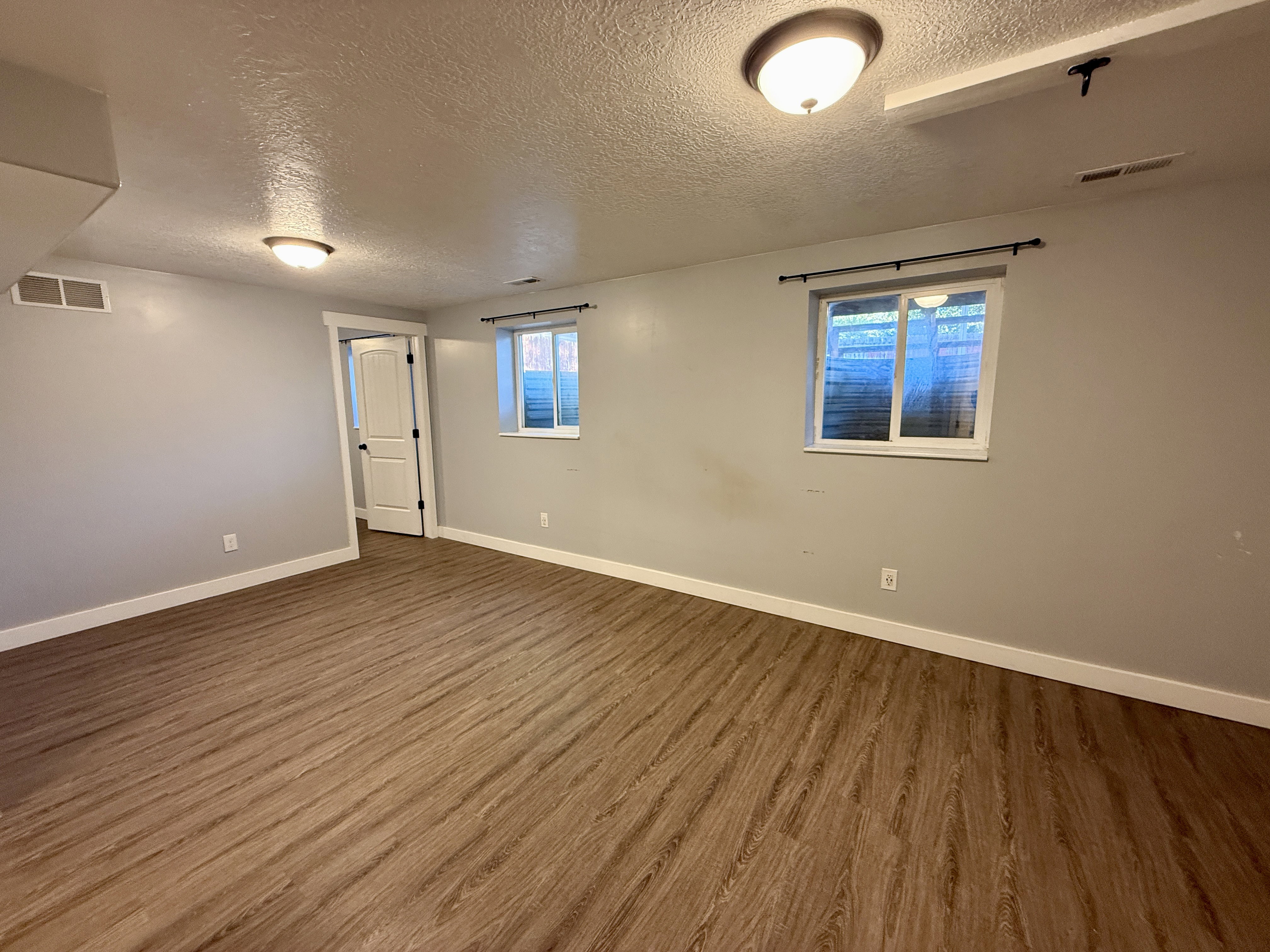 Basement Bedroom suite with walk in closet, bathroom and private/office or sitting room.