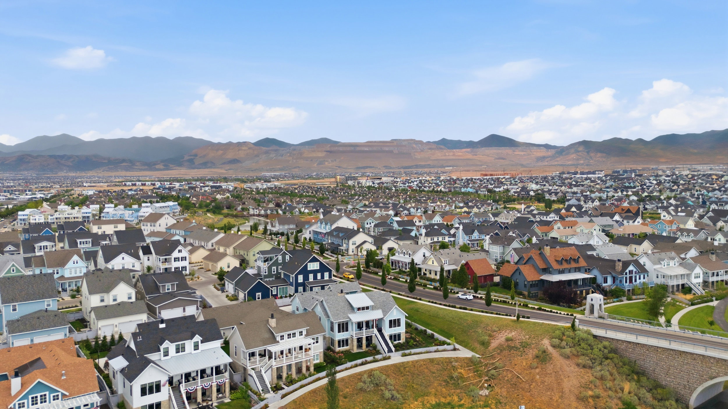 Expansive aerial perspective showcasing a residential community with diverse architectural styles