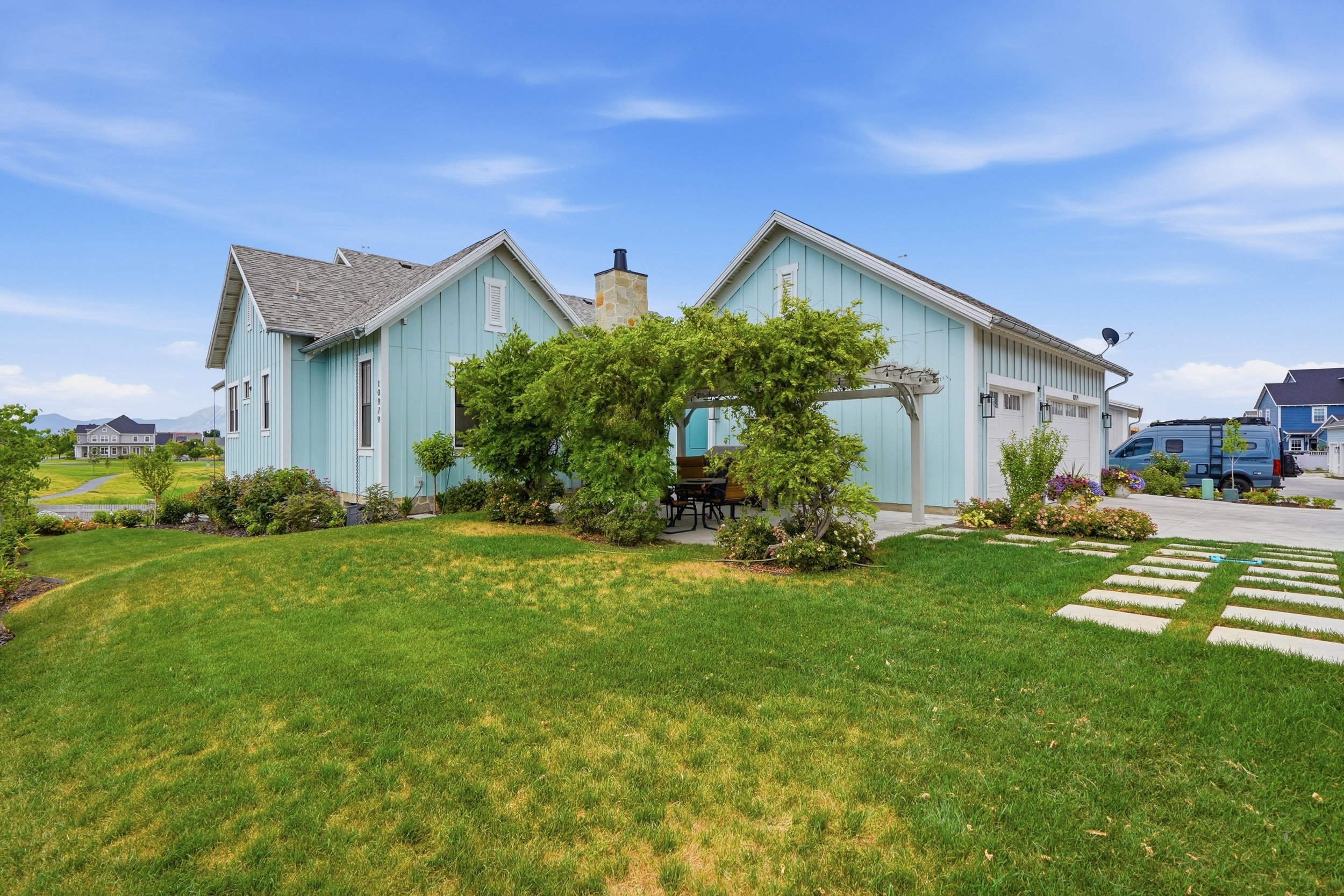 Contemporary light blue siding with white trim
