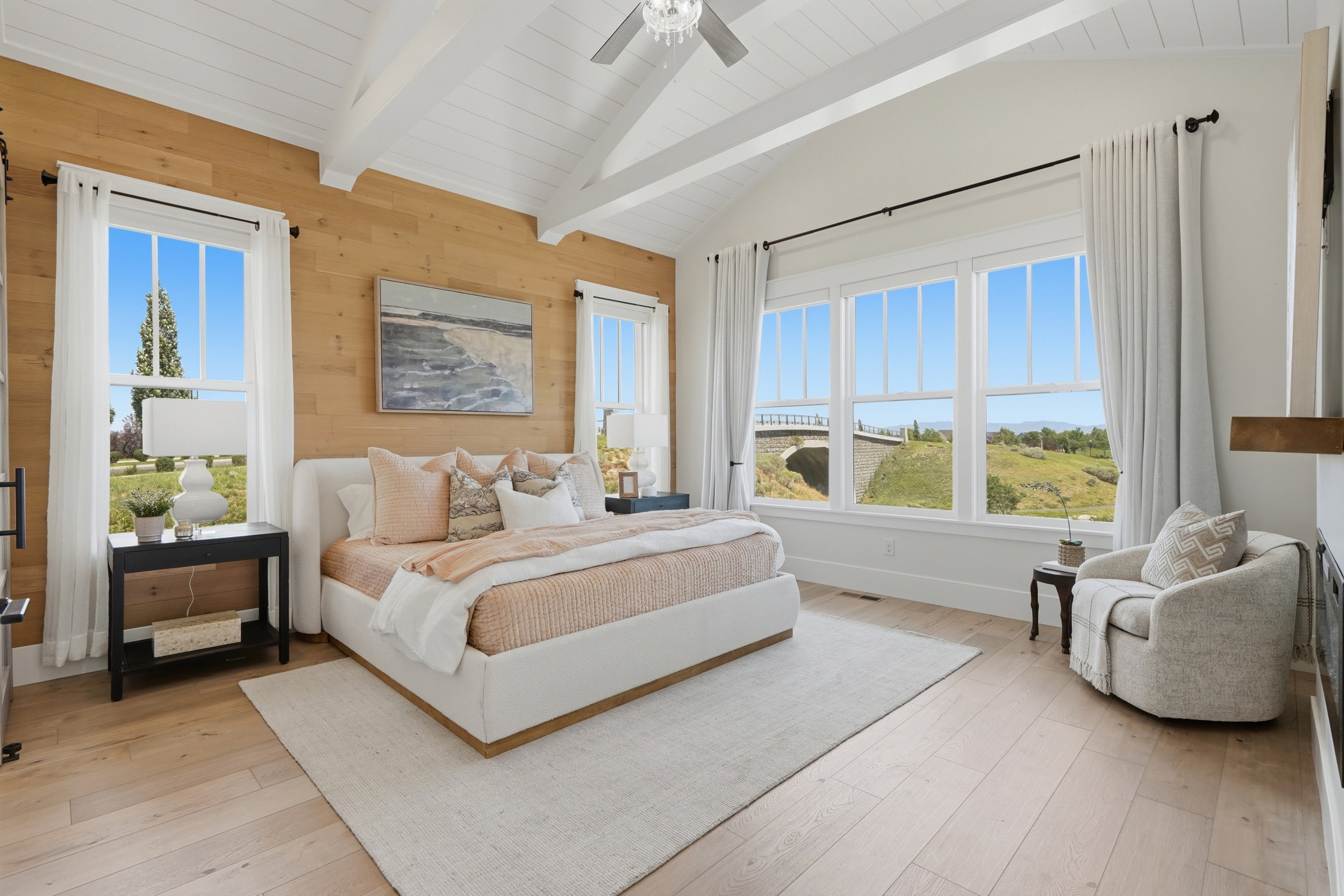 Vaulted ceiling featuring exposed beams and wood-finish flooring