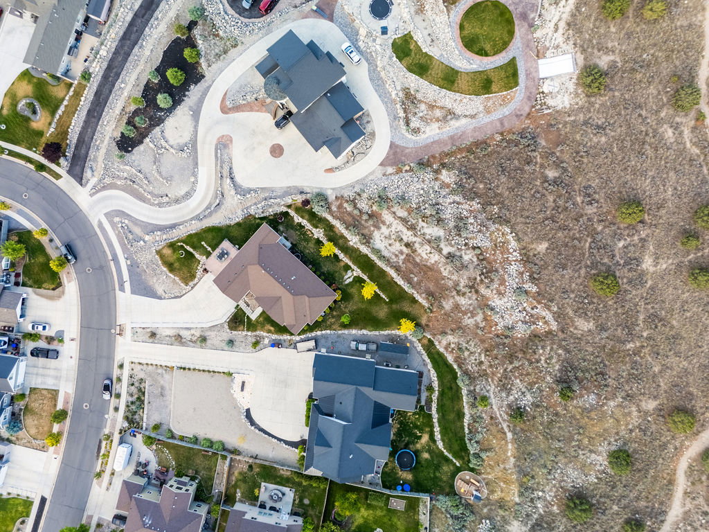 Aerial perspective showcasing a residential development with distinct property layouts