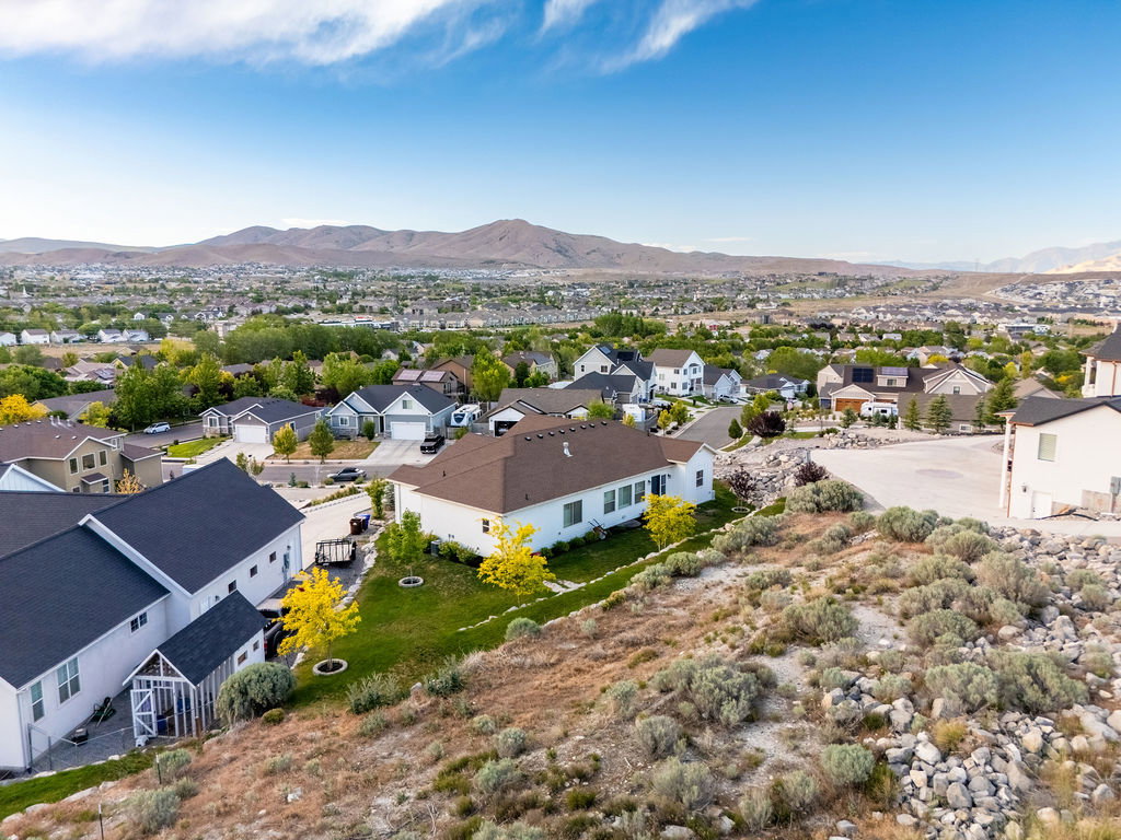 Elevated property offering a panoramic view of the surrounding residential area and distant mountains