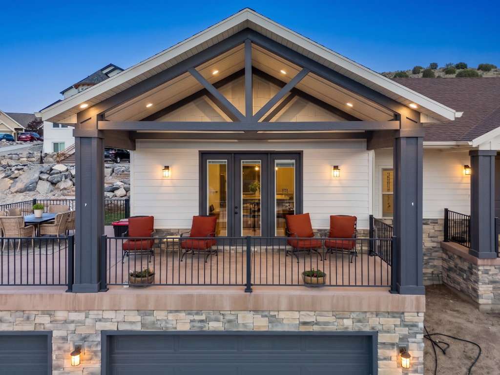 Two-story residence featuring a stone and siding facade
