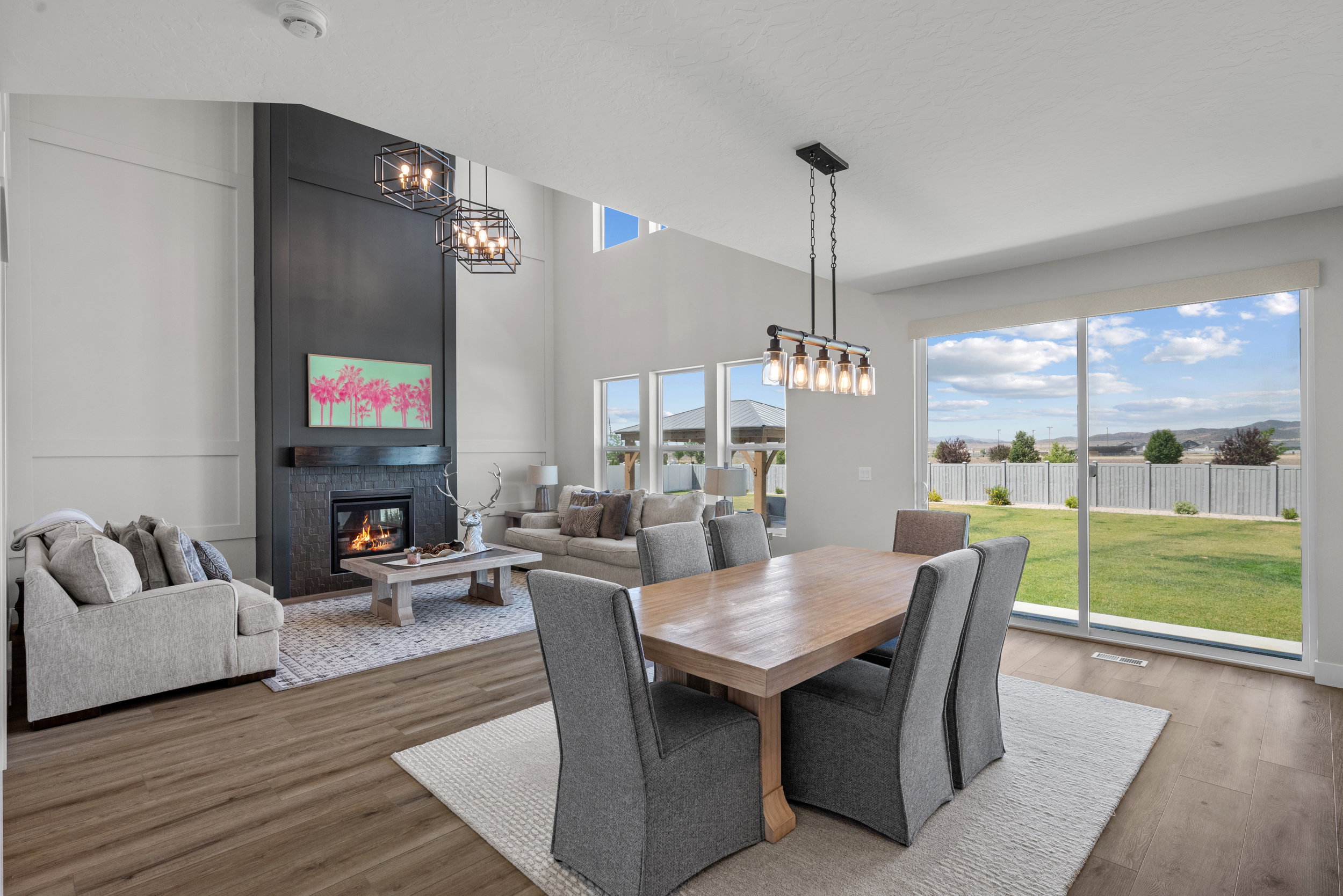 Spacious great room featuring high ceilings and wood-finish flooring