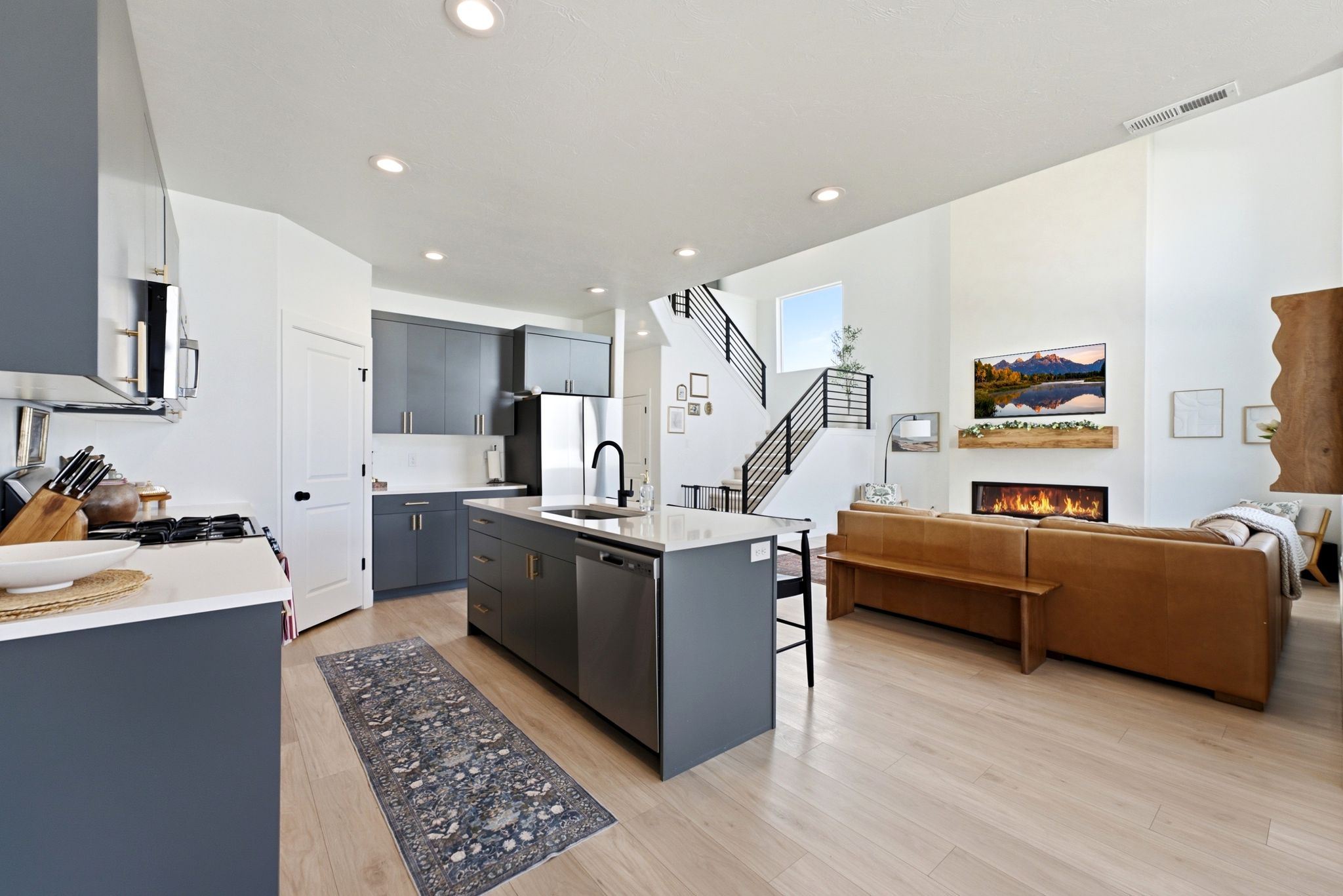 Open concept living space featuring wood-finish flooring